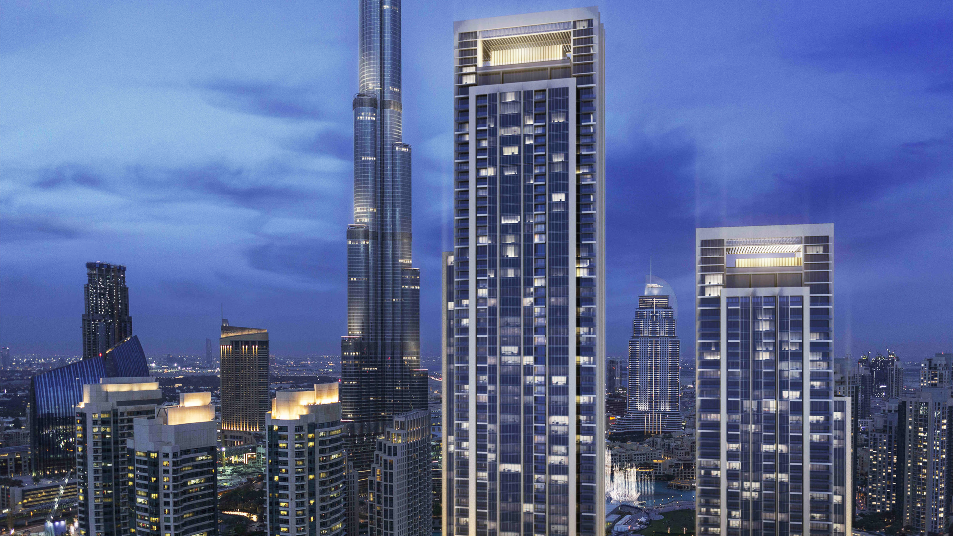 Luxurious bedroom in Forte apartment with stunning Downtown Dubai skyline views at night