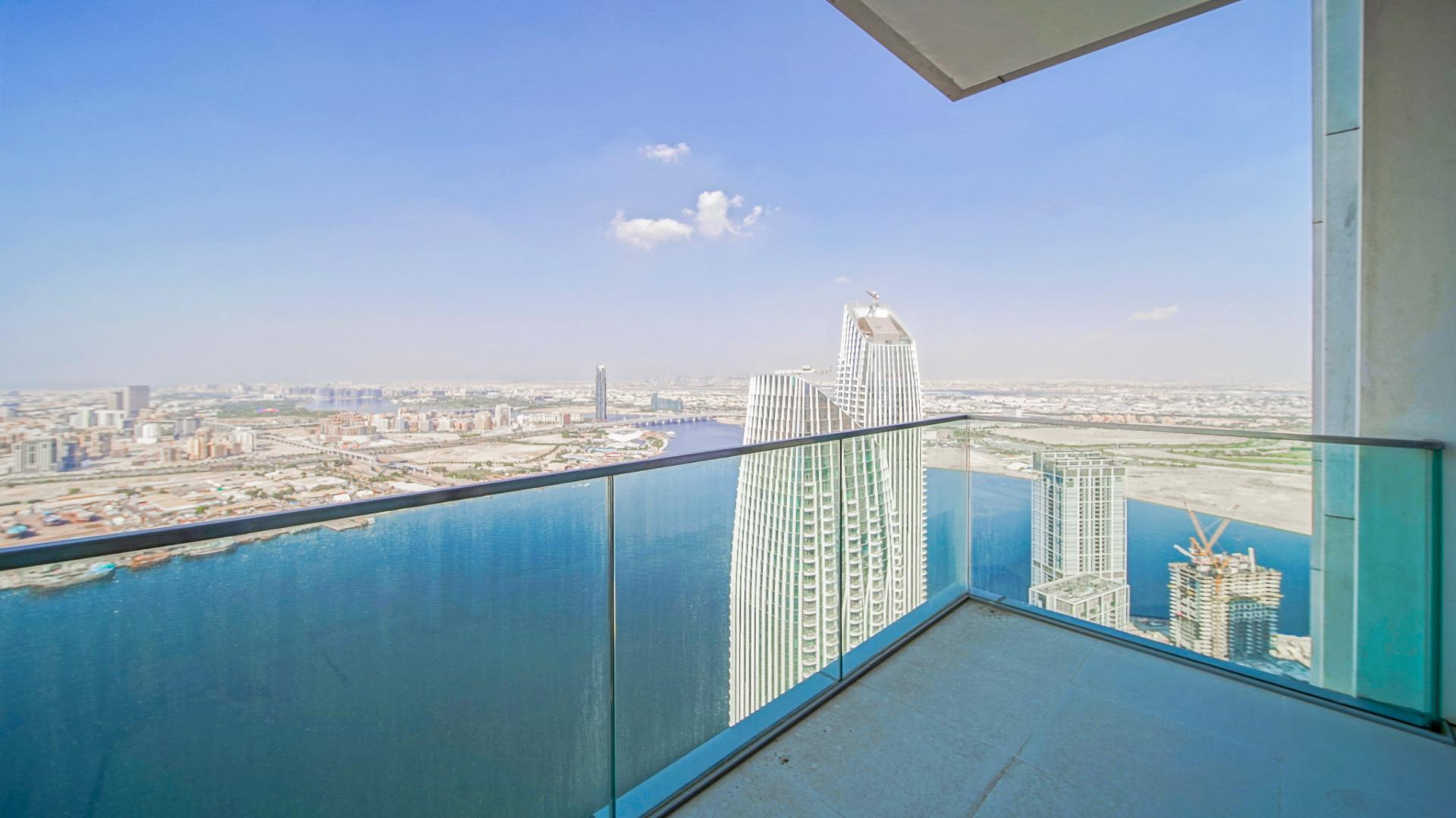 Luxurious living room with panoramic views in Dubai Creek Harbour apartment for sale