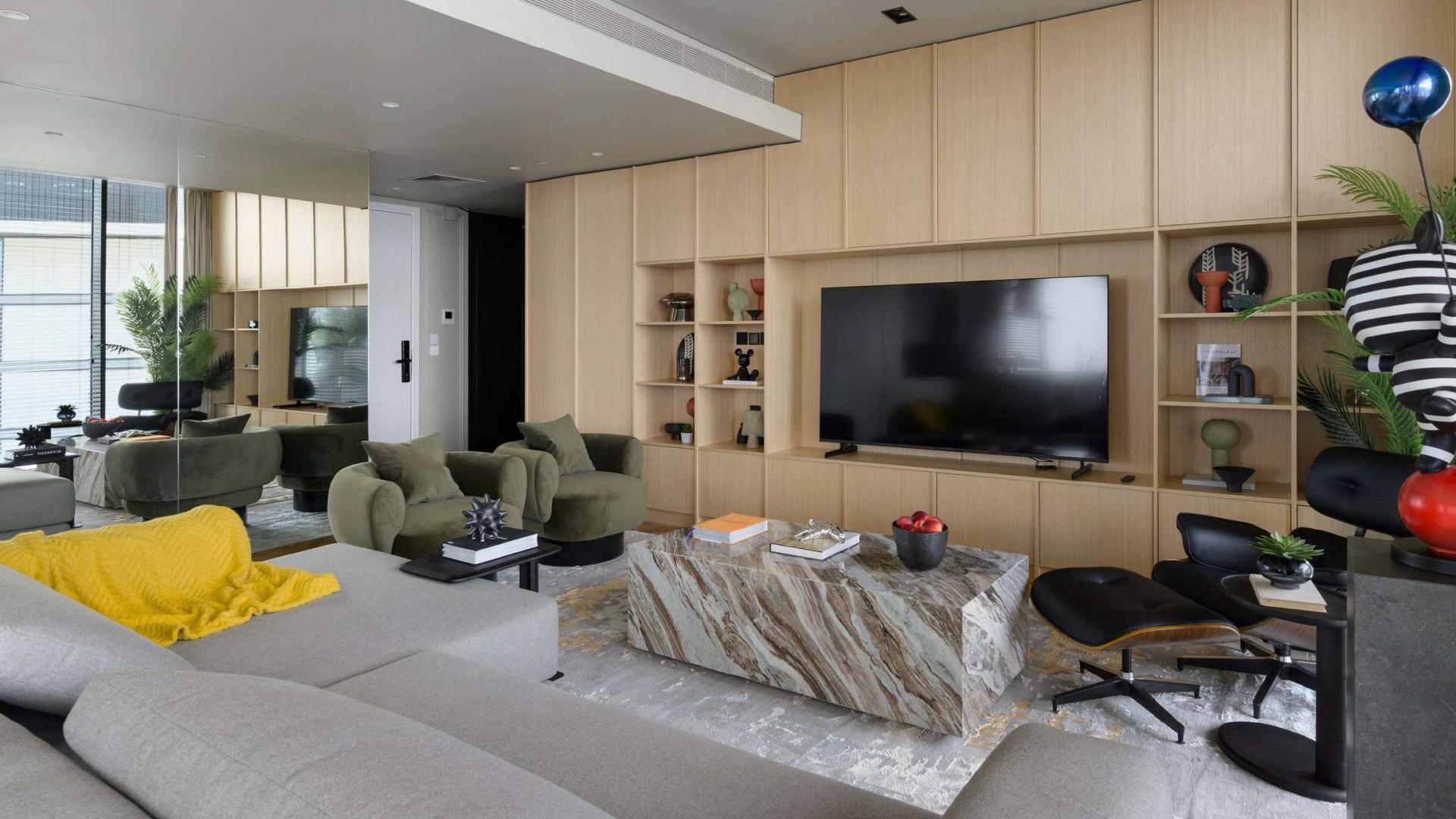 Partial sea view from Bluewaters apartment balcony, surrounded by modern buildings and palm trees