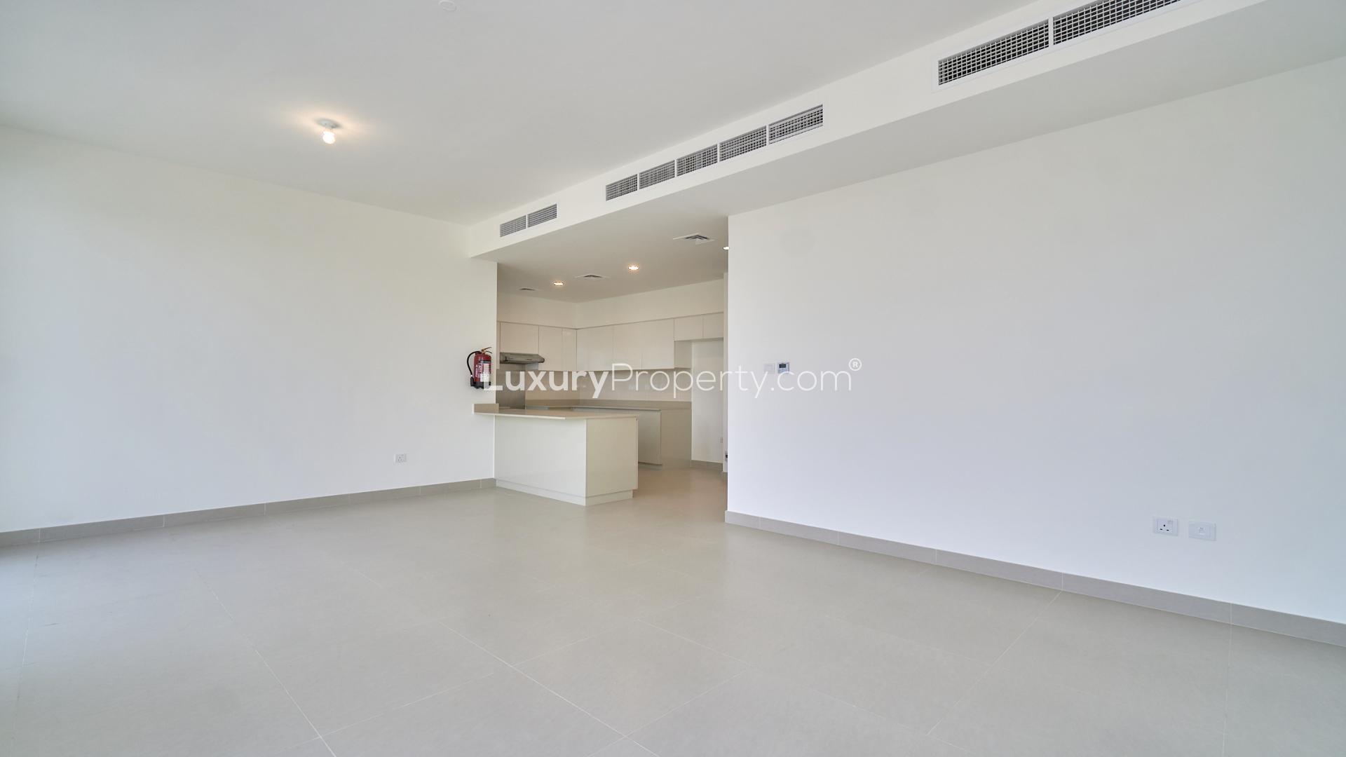 Modern single-row villa in Maple at Dubai Hills Estate, featuring spacious driveway and greenery