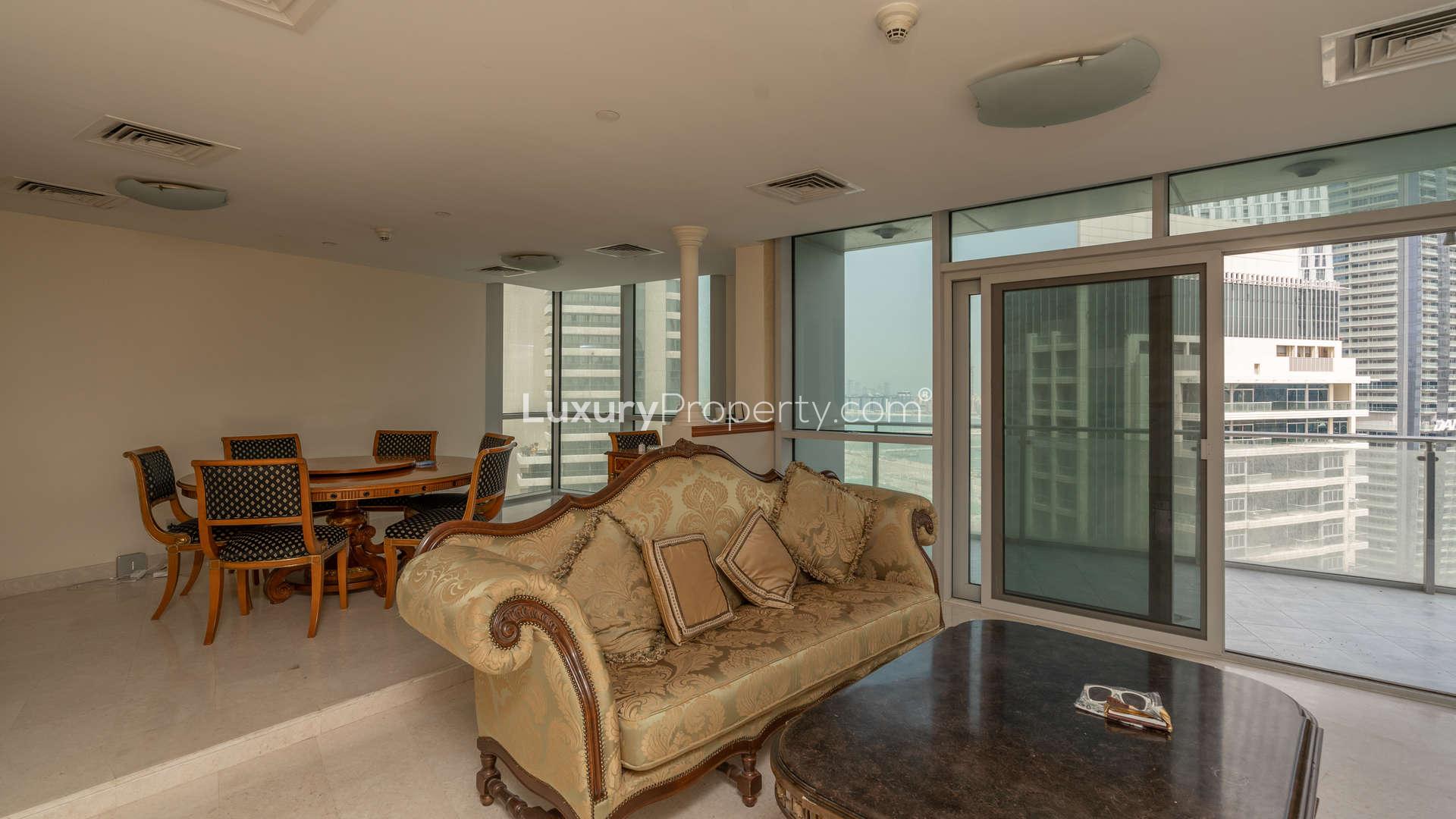 Aerial view of Dubai Marina with yachts and skyscrapers near Marina Terrace apartments