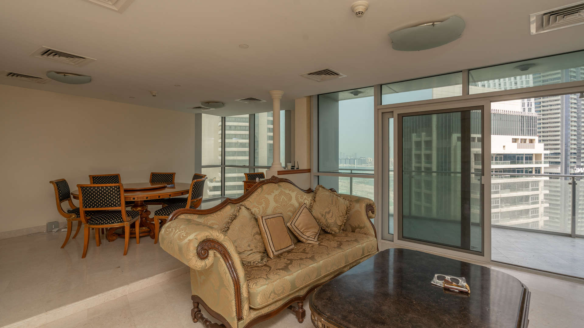 Aerial view of Dubai Marina with yachts and skyscrapers near Marina Terrace apartments