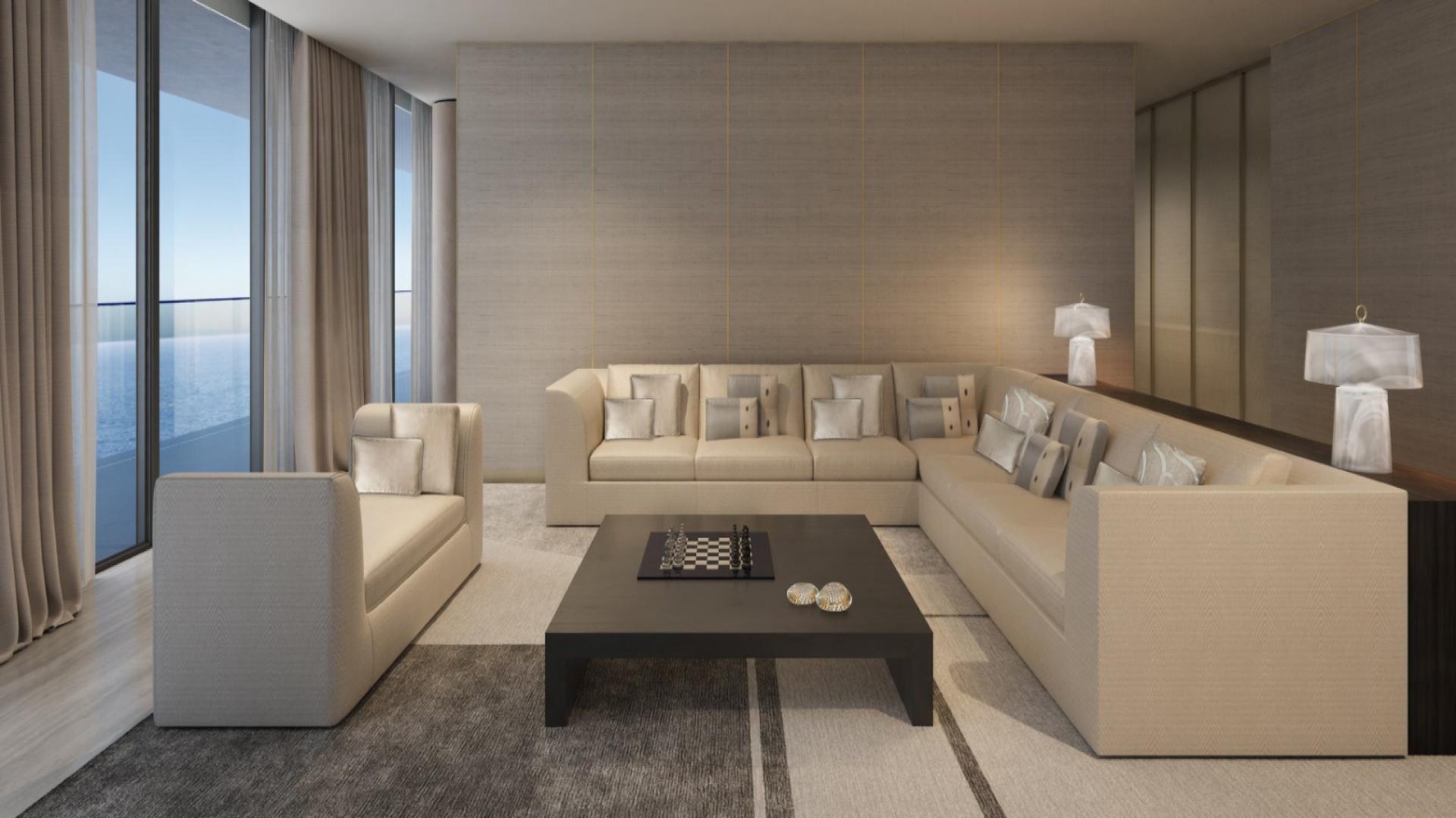 "Elegant dining area in 4-bedroom apartment, Armani Beach Residences, Palm Jumeirah, ocean view.",Modern living room in Armani Beach Residences apartment, Palm Jumeirah, featuring elegant furnishings