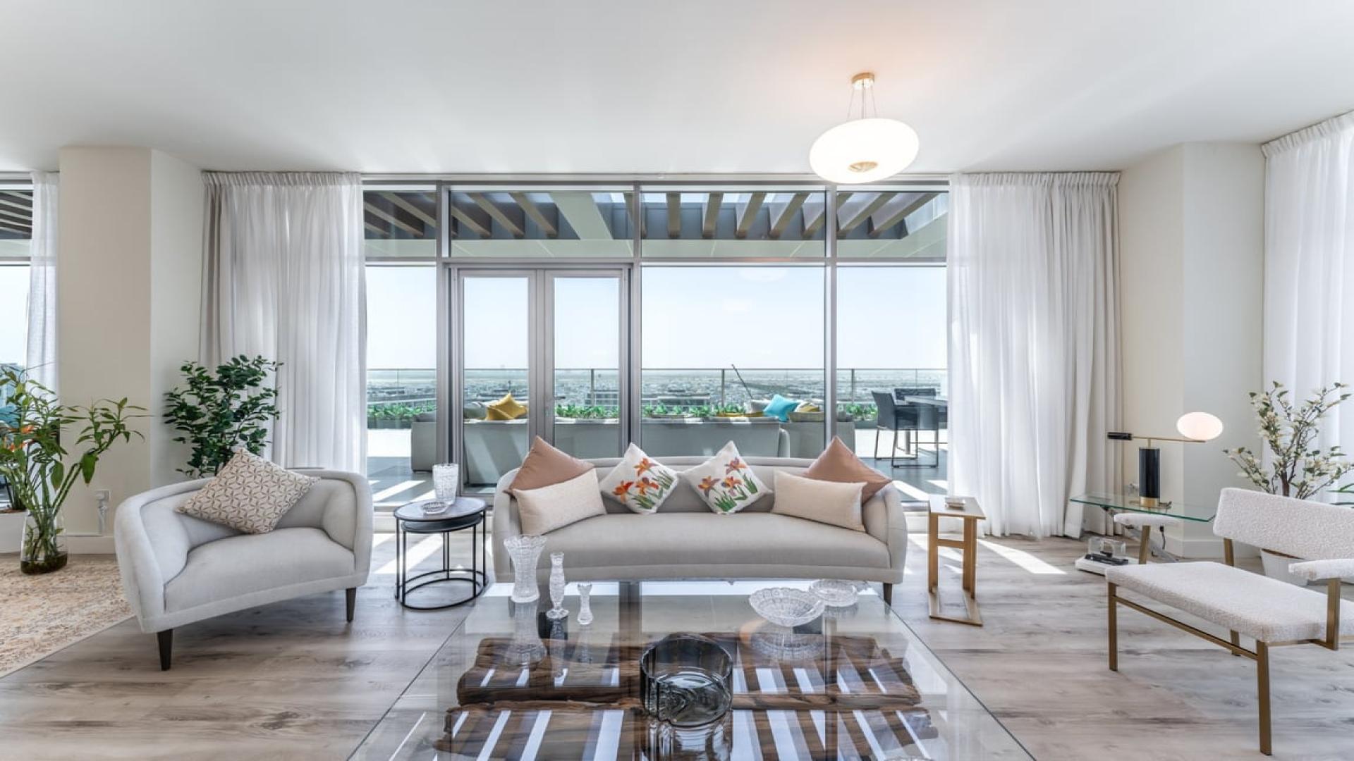 Luxurious penthouse living room with terrace views in Dubai Hills Estate, Park Heights