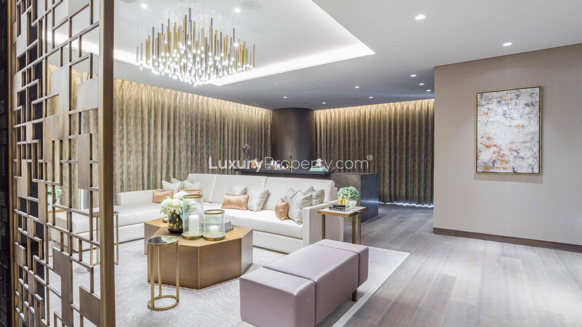 Luxurious living room and dining area in Palm Jumeirah apartment with elegant chandelier