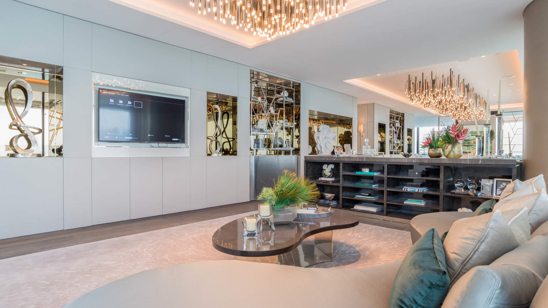 Luxurious living room in four-bedroom Palm Jumeirah apartment with elegant decor and modern design