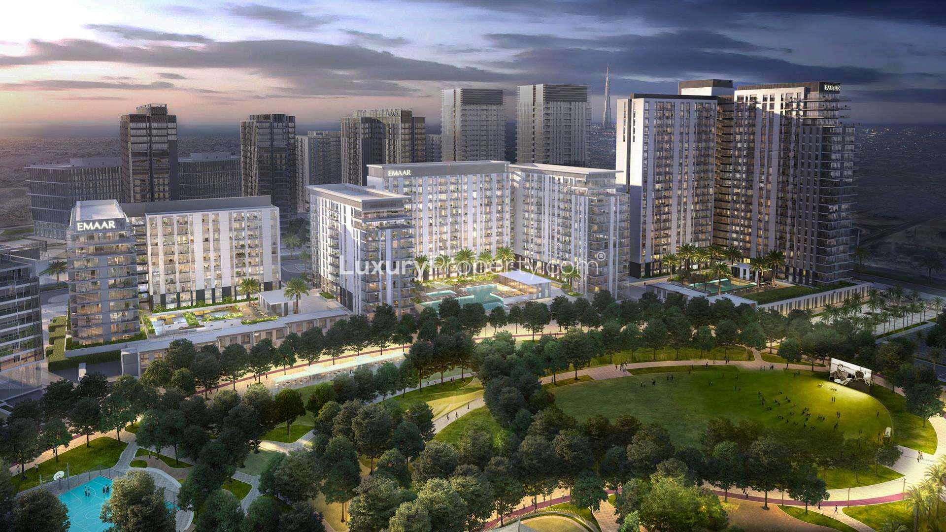 Aerial view of Dubai Hills Estate Park Field at dusk, showcasing lush greenery and pathways