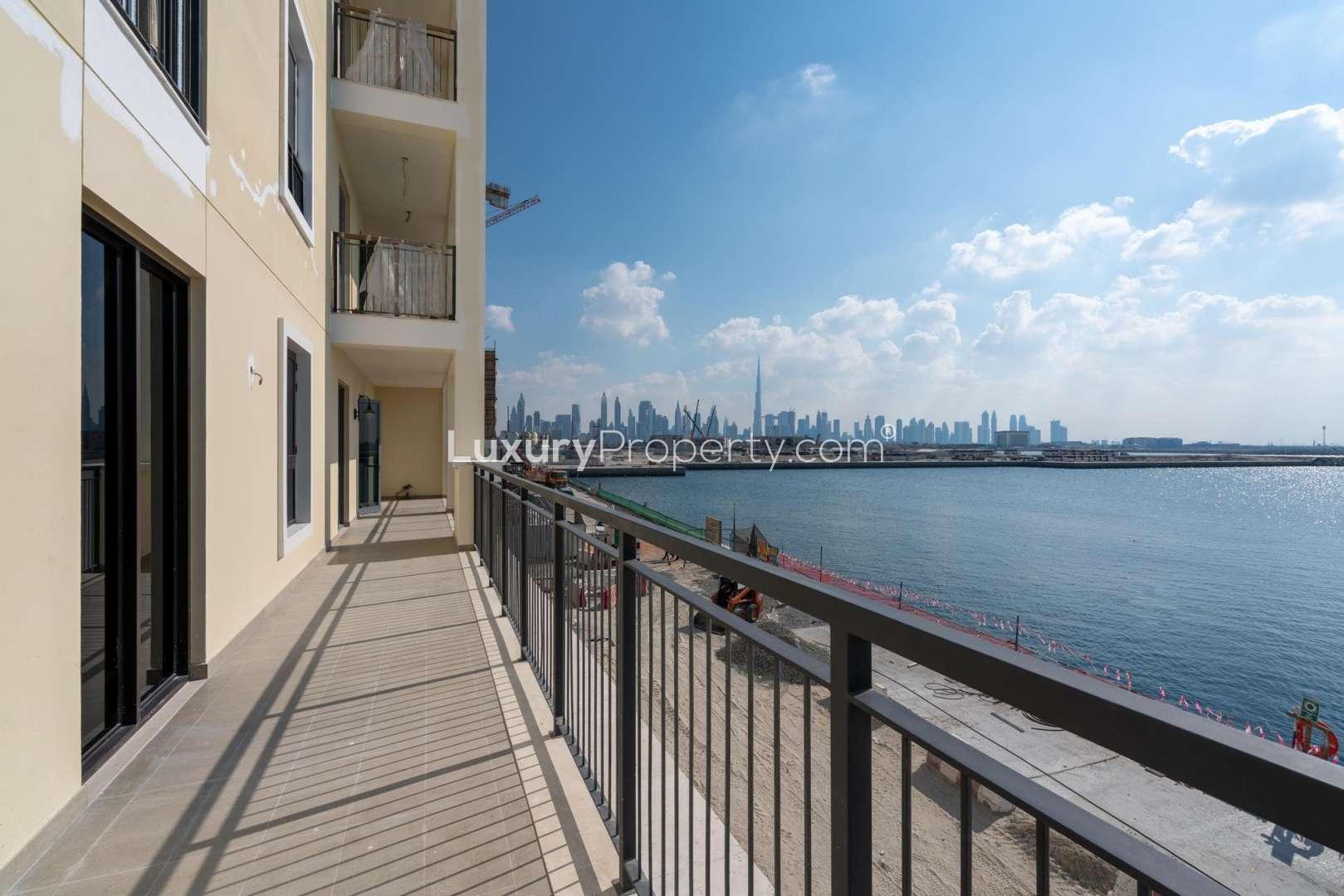 La Mer entrance with palm trees, Jumeirah community, near four-bedroom apartment for sale