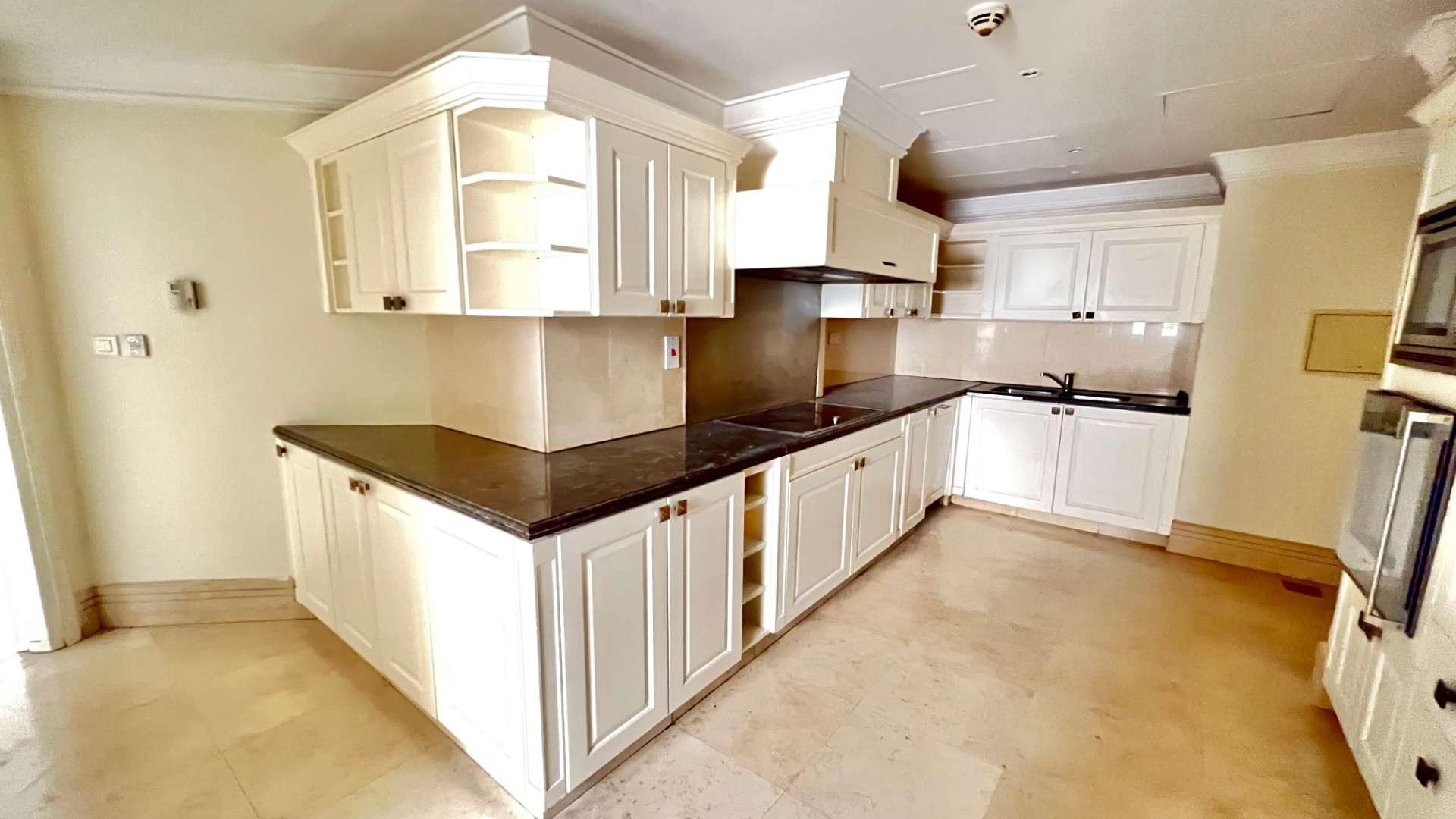 "Spacious duplex apartment with full Marina view, Jumeirah Beach Residence, Sadaf community.",Kitchen in 4-bedroom duplex apartment, Jumeirah Beach Residence, Sadaf, with modern white cabinetry