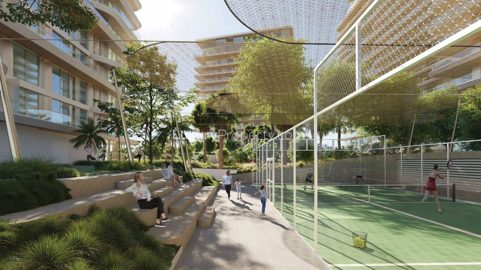 Aerial view of luxury pool and beach at Serenia Living, Palm Jumeirah apartment complex