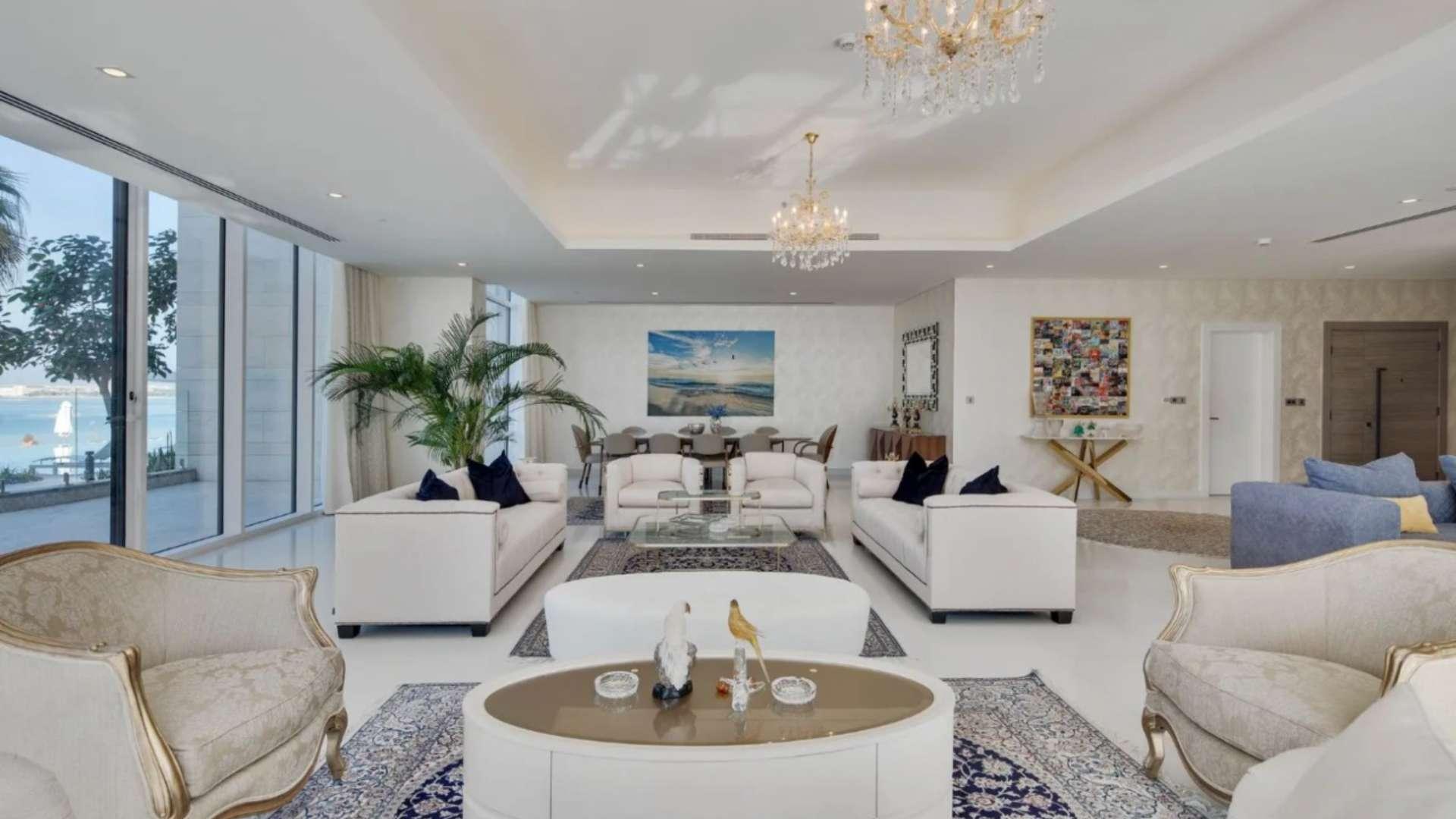 Luxurious interior of Palm Jumeirah penthouse, featuring elegant decor and spacious living area