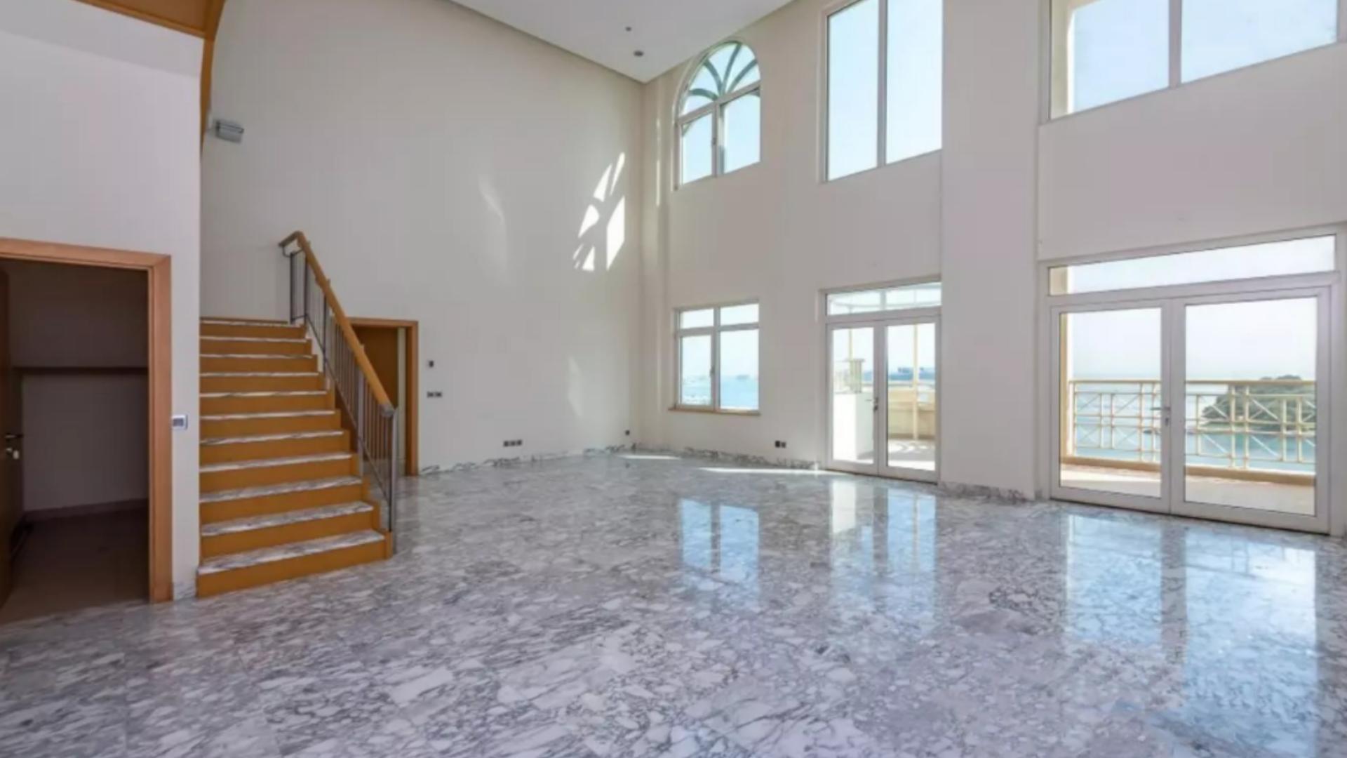 Luxurious staircase in 4-bedroom penthouse, Shoreline Apartments, Palm Jumeirah. Marble flooring, modern design