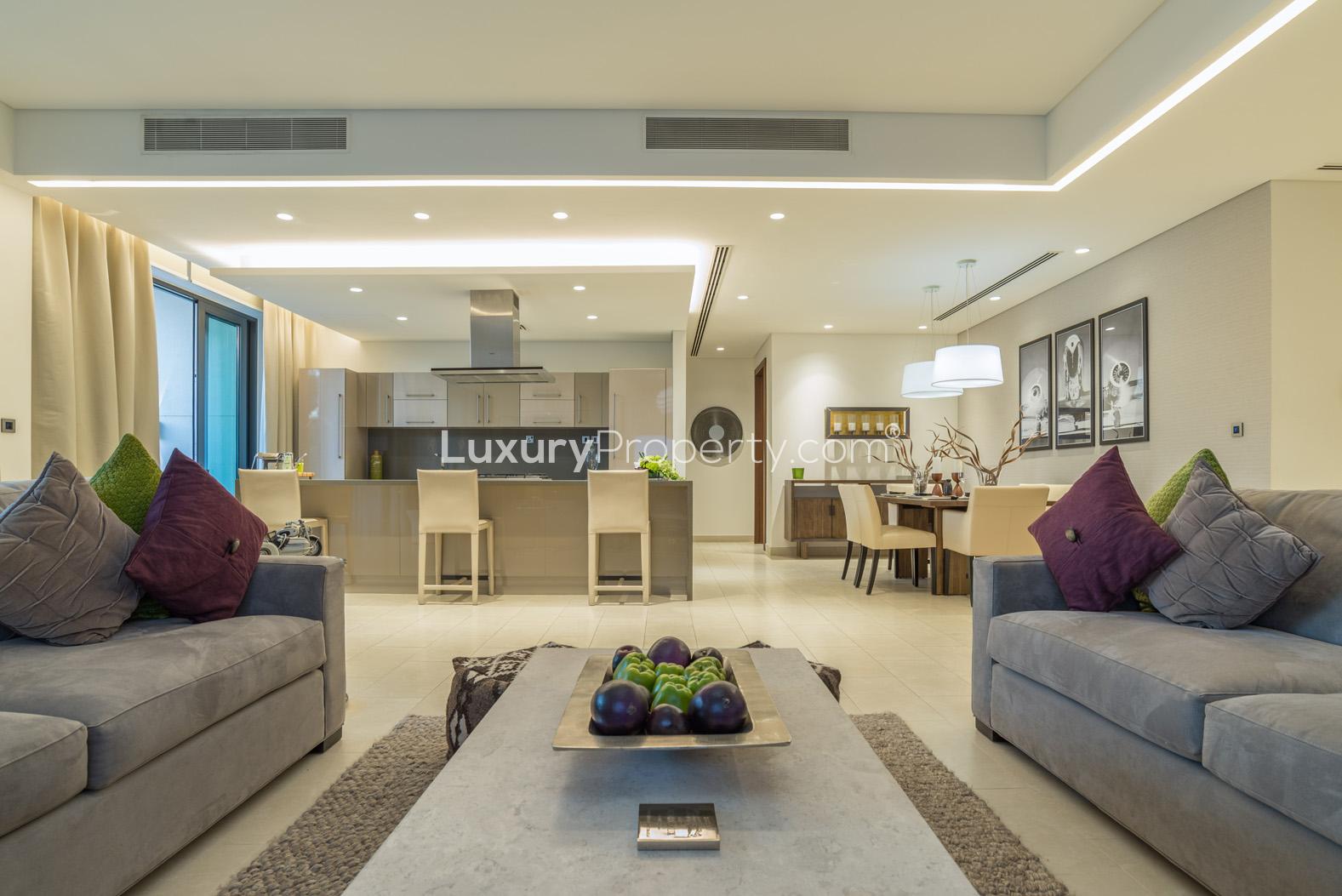Outdoor terrace of elegant three-bedroom duplex in Sobha Hartland Greens, Dubai, with seating area