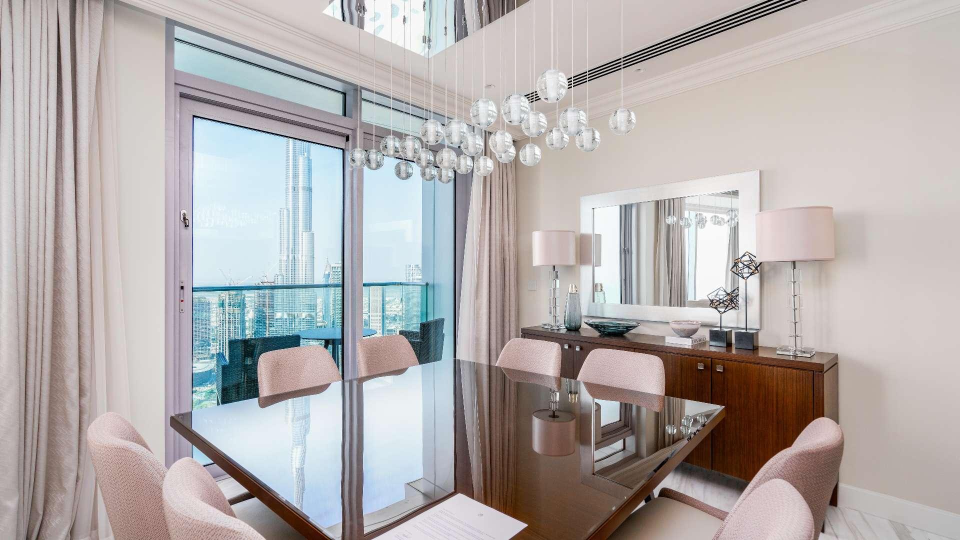Luxurious living room in Downtown Dubai duplex apartment, elegant design with chandelier