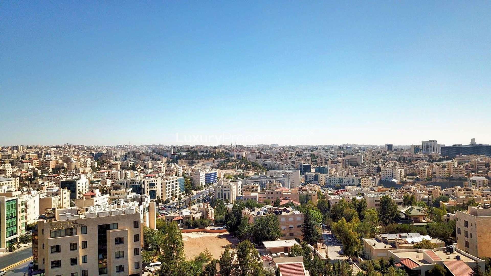 Skyline view of Amman near The Ritz-Carlton Residences, showcasing cityscape and architecture