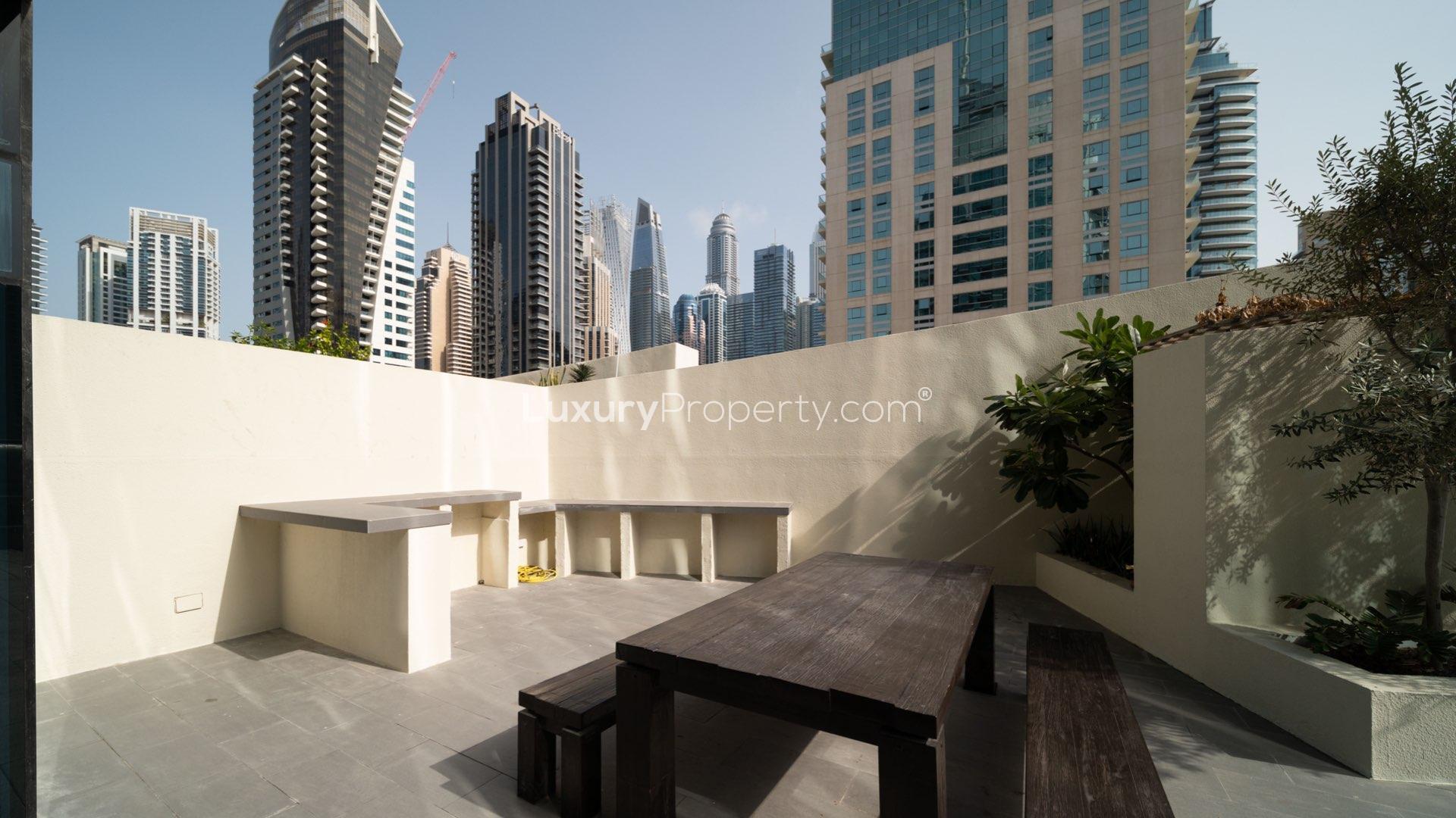 Luxurious living and dining area in upgraded Dubai Marina duplex apartment for sale