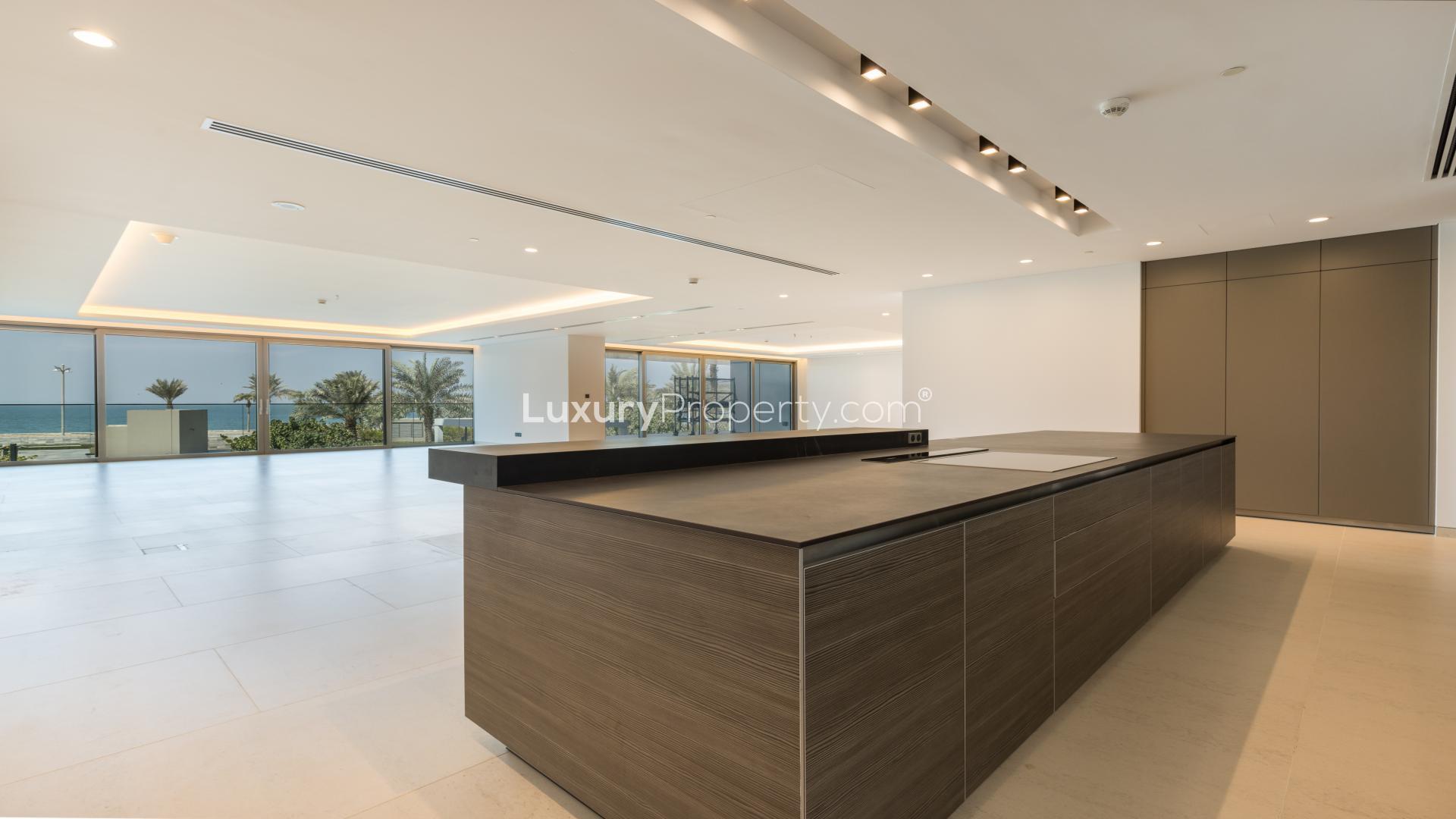 Penthouse view at W Residences, Palm Jumeirah with pool and lush garden scenery