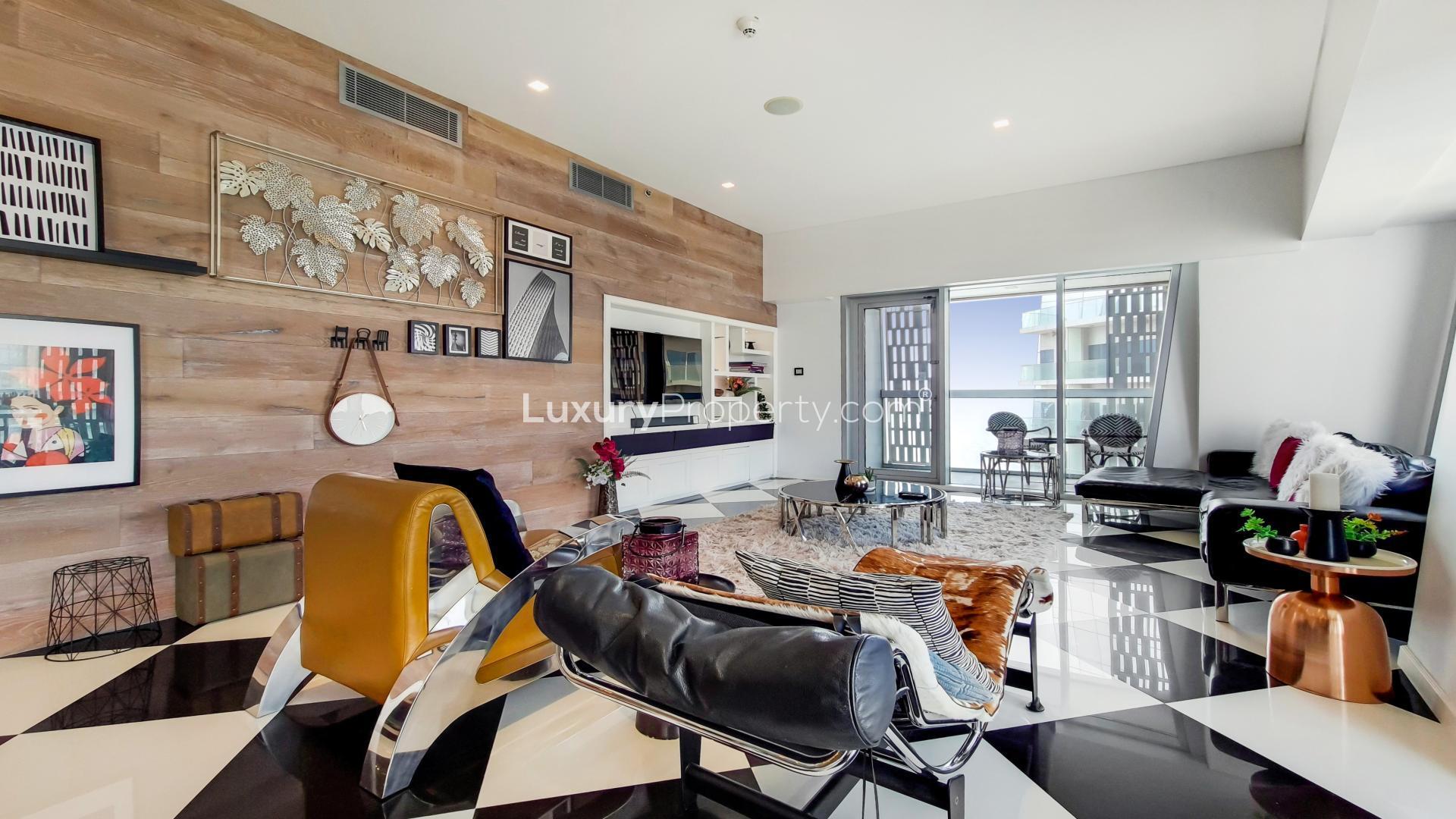 Dubai Marina skyline view from Cayan Tower apartment, featuring waterfront and luxury yachts