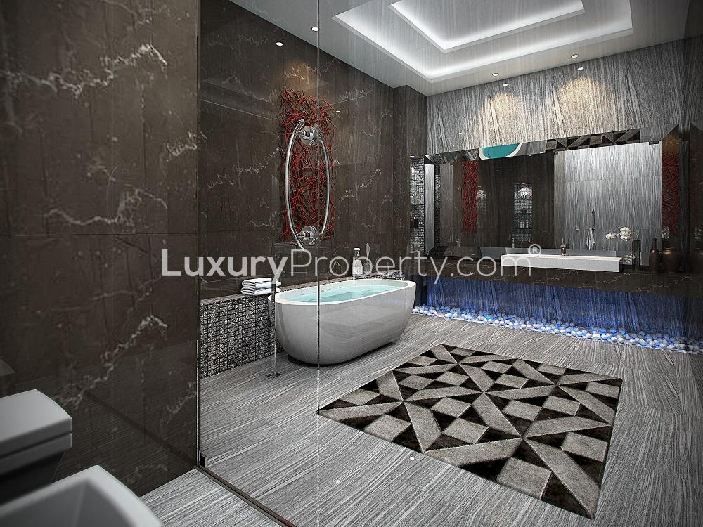 "Luxurious penthouse patio with pool at Anantara Residences, Palm Jumeirah, for sale.",Luxurious bathroom in Palm Jumeirah penthouse with modern design and elegant freestanding tub