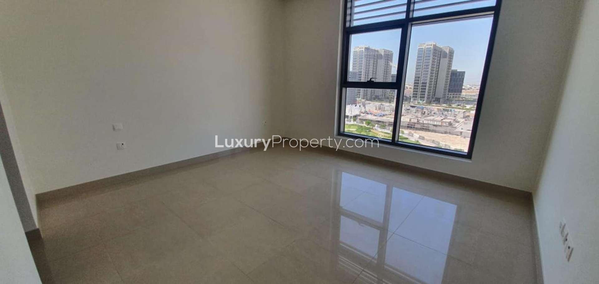 Spacious living area in luxury duplex apartment, Dubai Hills Estate, large windows, natural light