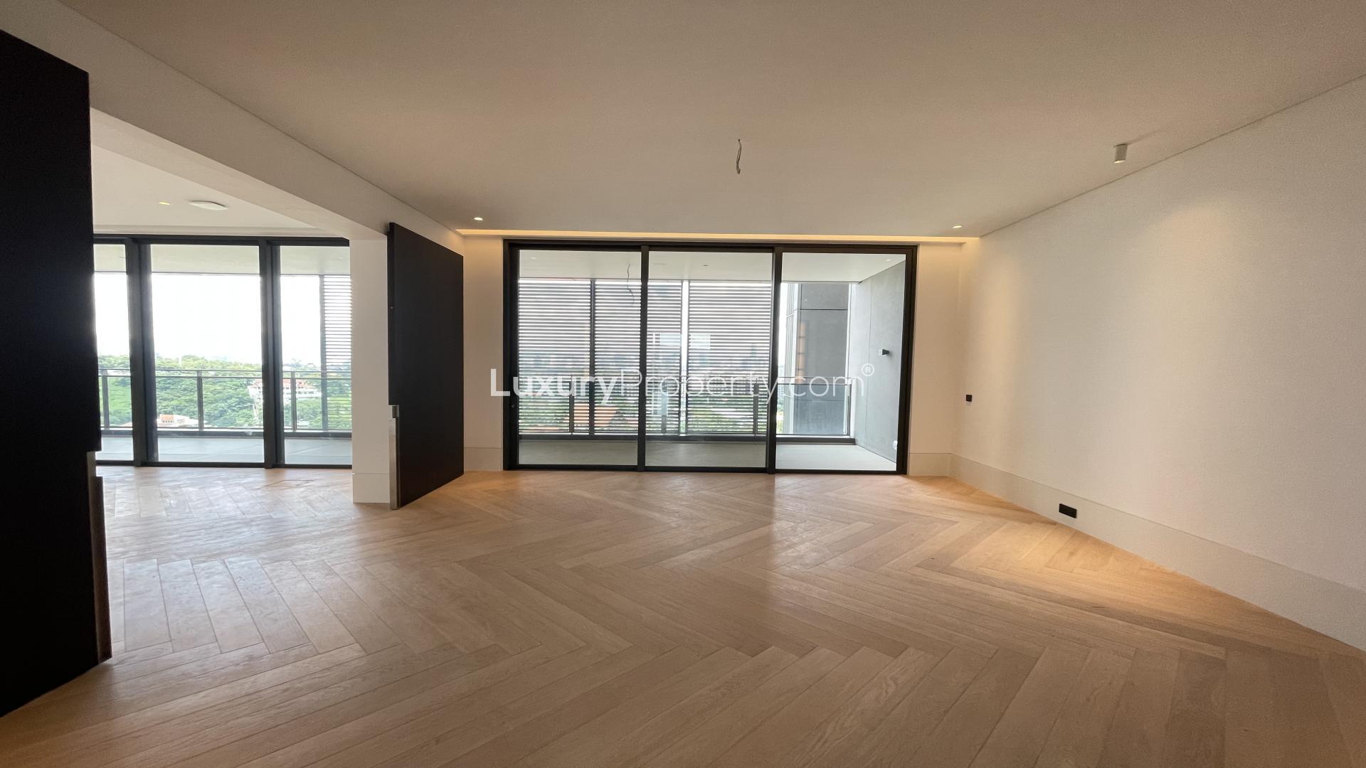 Spacious living area with floor-to-ceiling windows in AIRA Residence, Damansara Heights, Kuala Lumpur