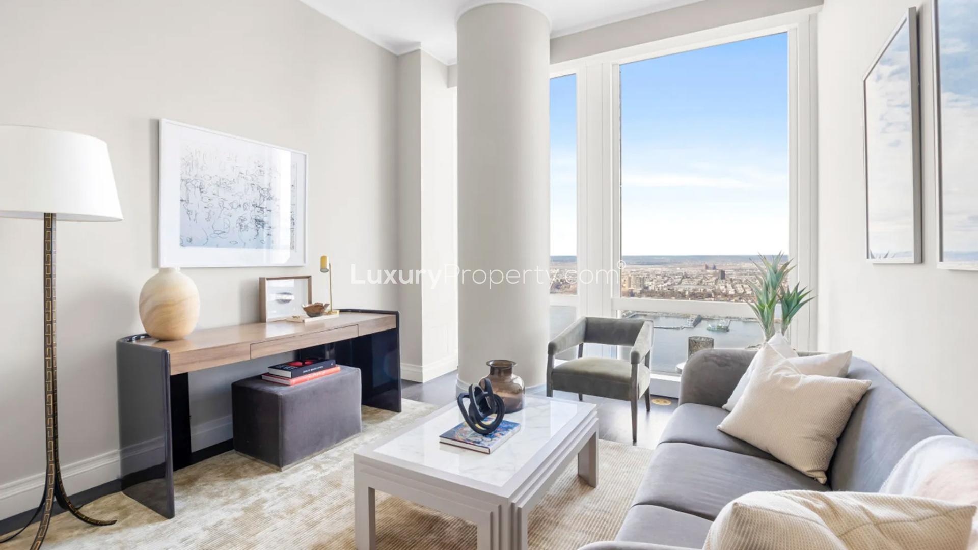 Luxurious Manhattan condo living room with stunning Hudson River views, modern furniture, bright decor