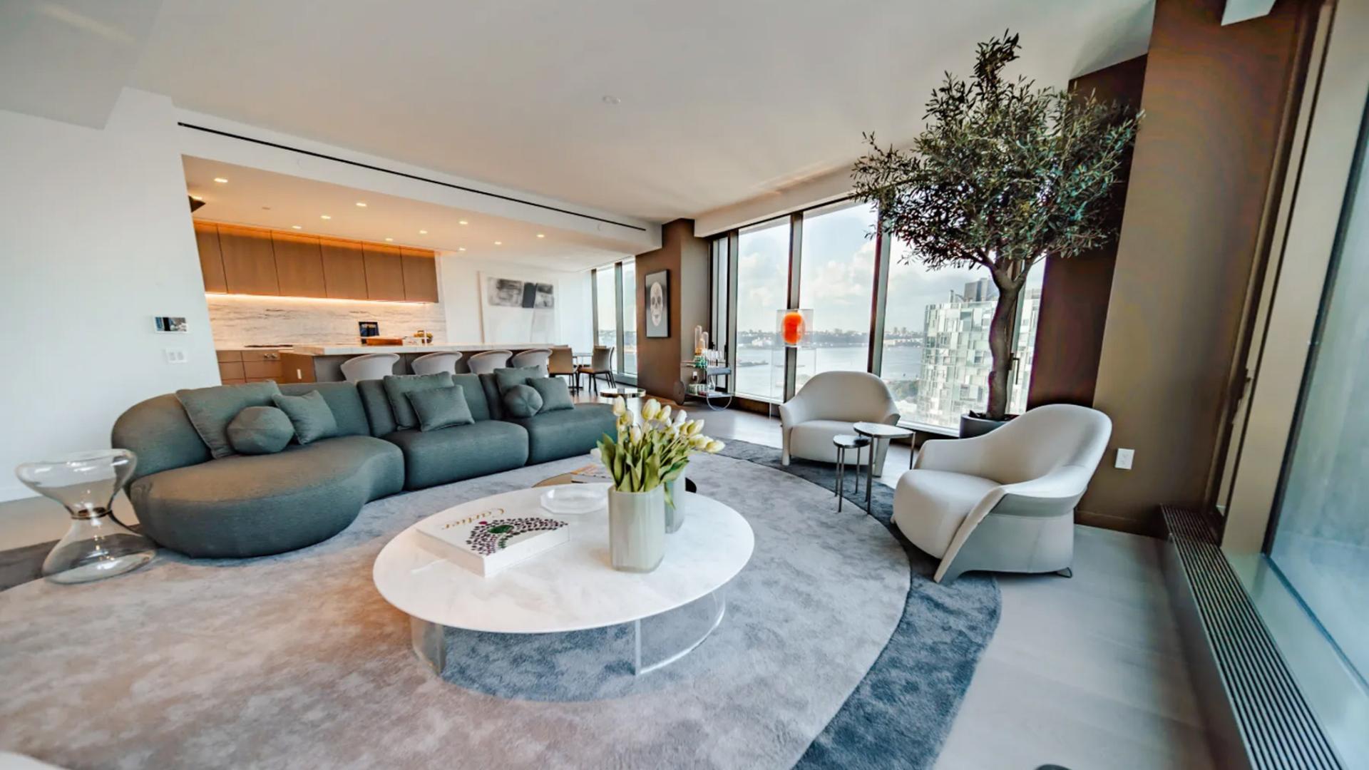 Luxurious Manhattan condominium living room with city views, modern decor, and ample natural light