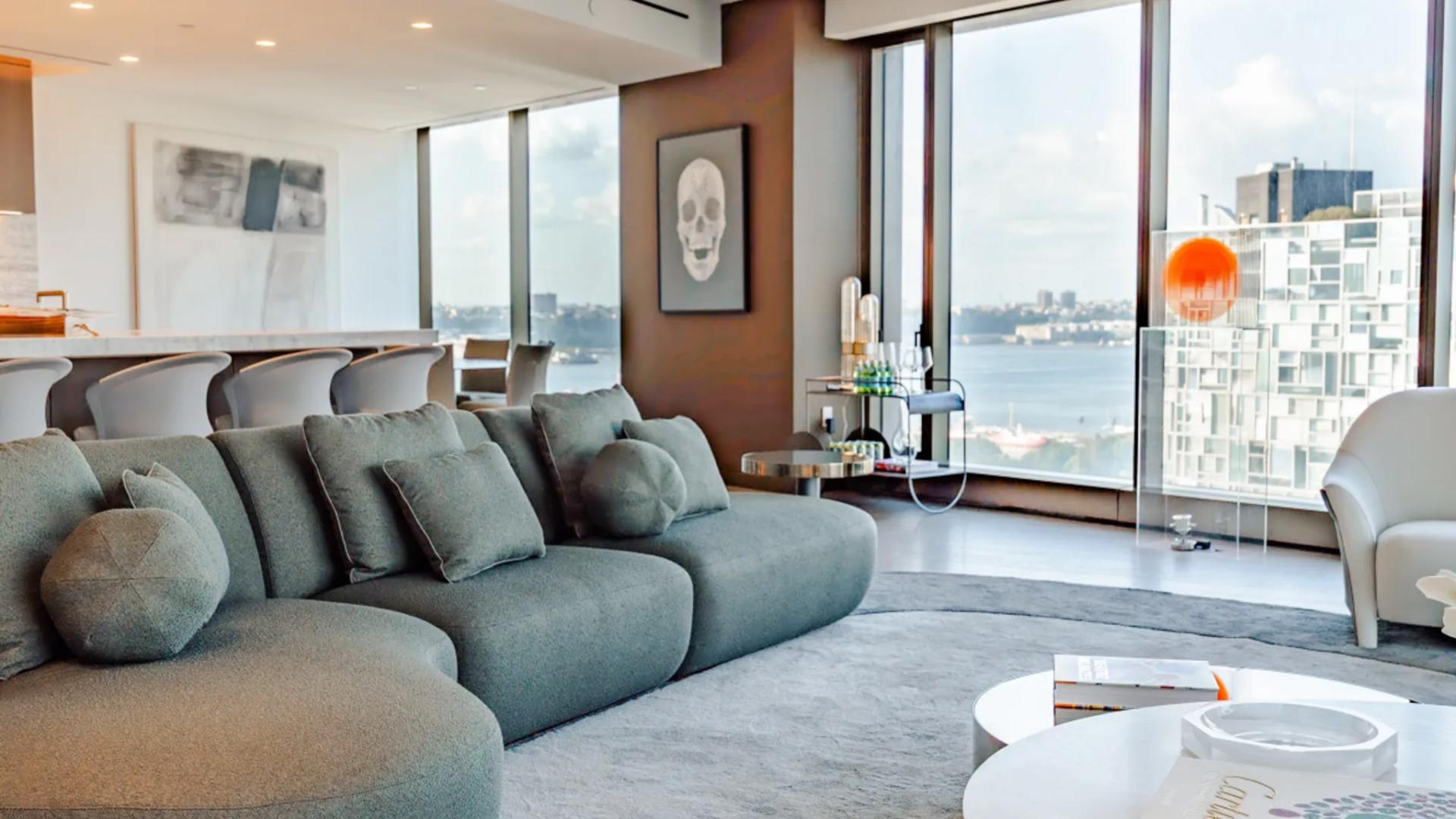 Luxurious Manhattan condominium living room with High Line views, modern decor, and large windows
