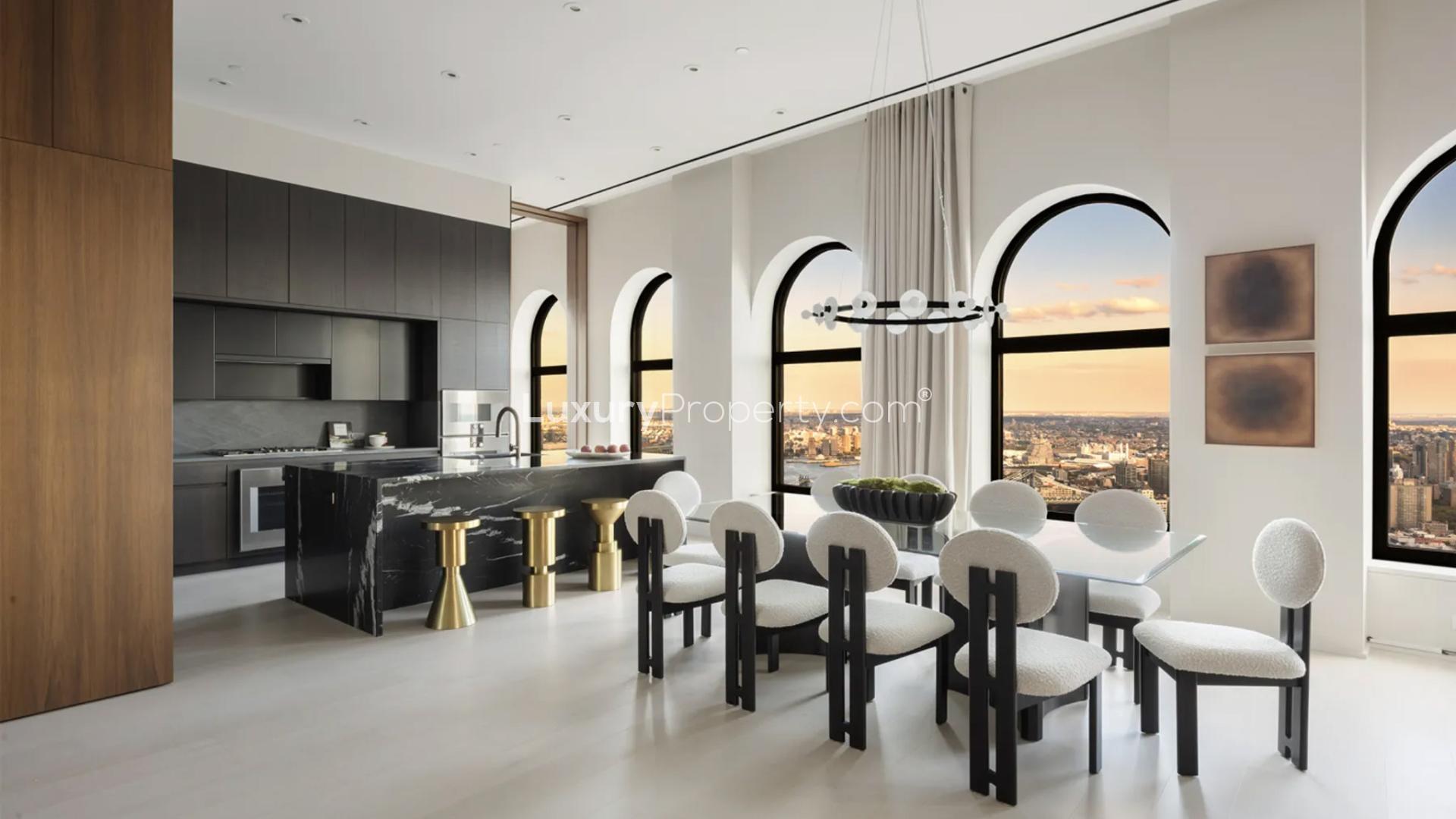 Luxurious penthouse living room with skyline views at 130 William, Manhattan