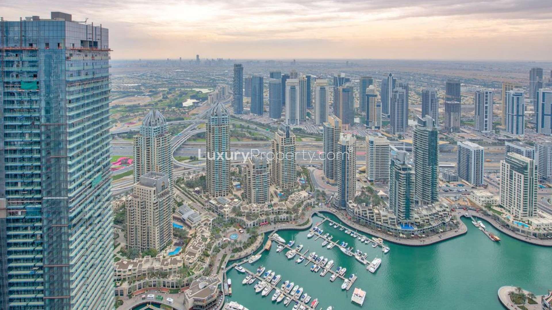 Modern kitchen in luxurious Cayan Tower penthouse, Dubai Marina, featuring sleek design and appliances