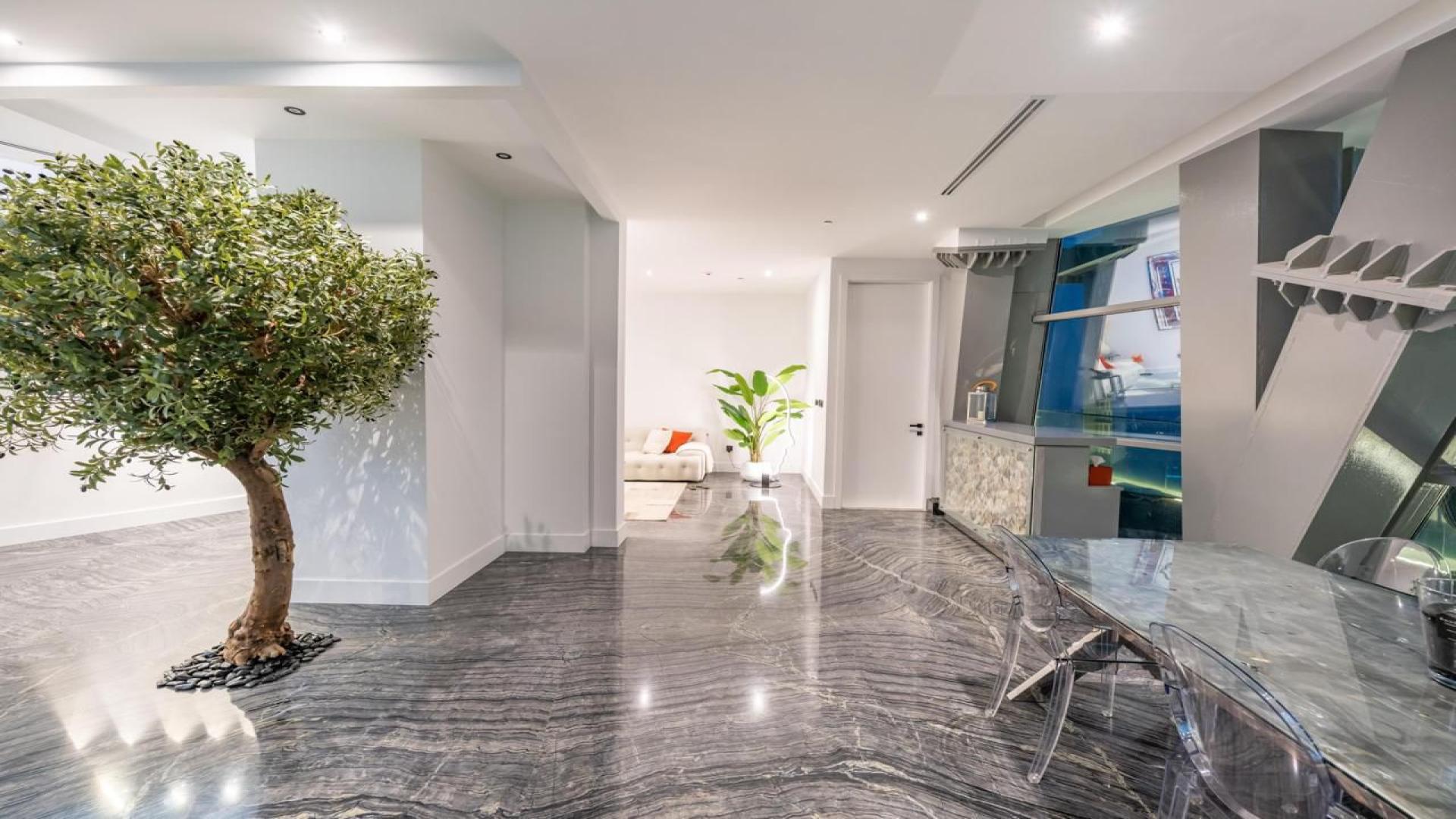 Luxury penthouse kitchen in Cayan Tower, Dubai Marina with modern design and sea views