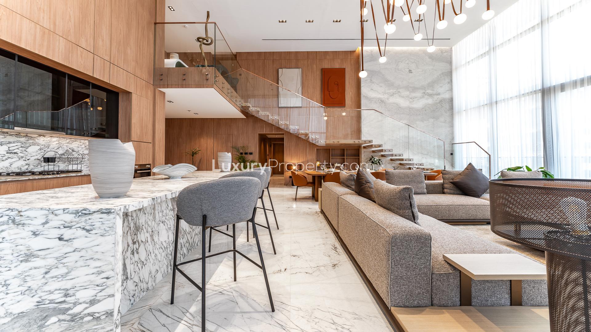 Luxurious duplex penthouse living area with city views in Business Bay, marble flooring