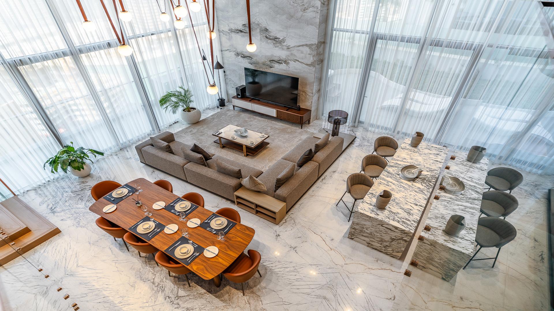 Luxurious Business Bay penthouse interior with modern design, marble finishes, and elegant staircase