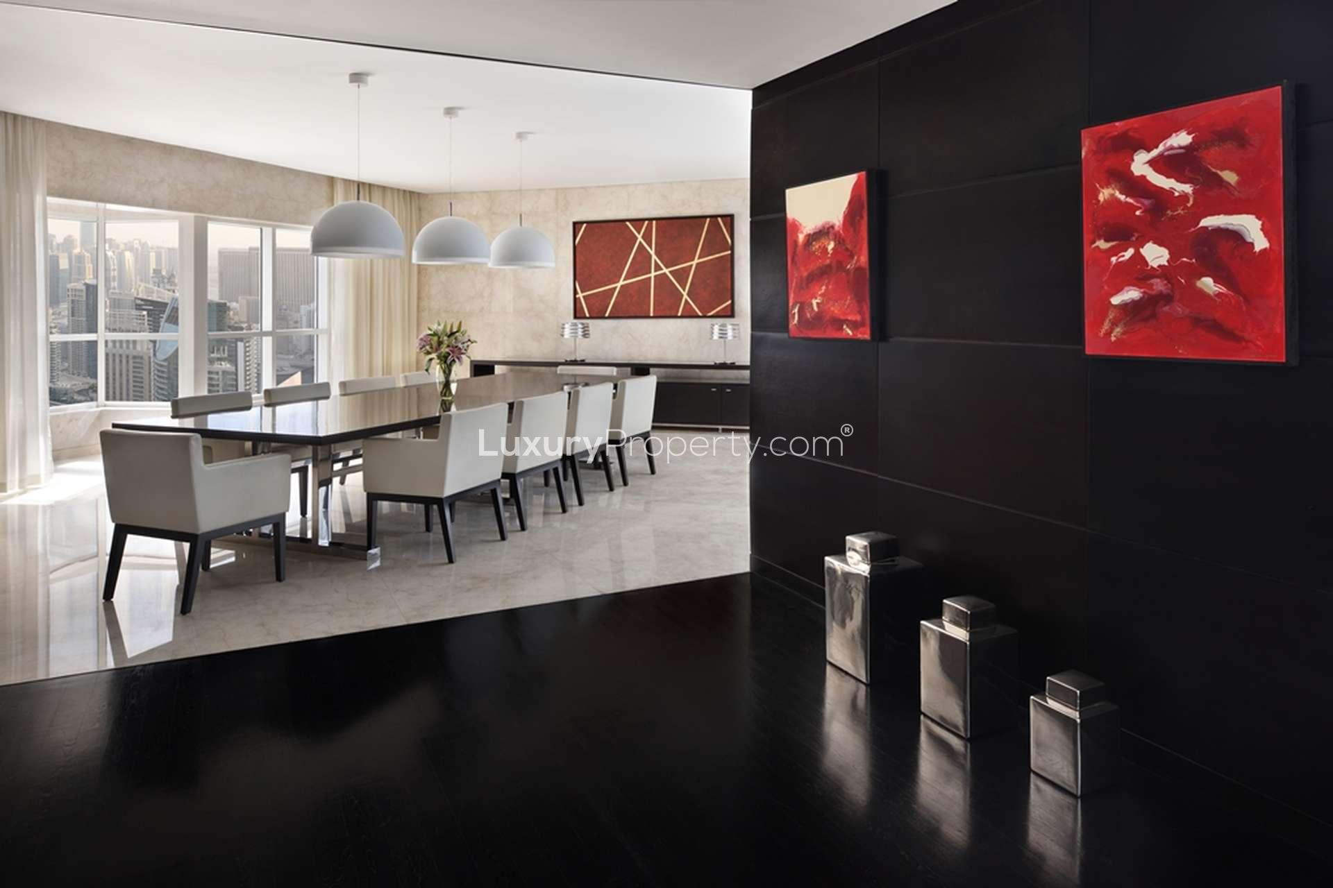 Elegant dining area in Dubai Marina penthouse, featuring modern decor and city views