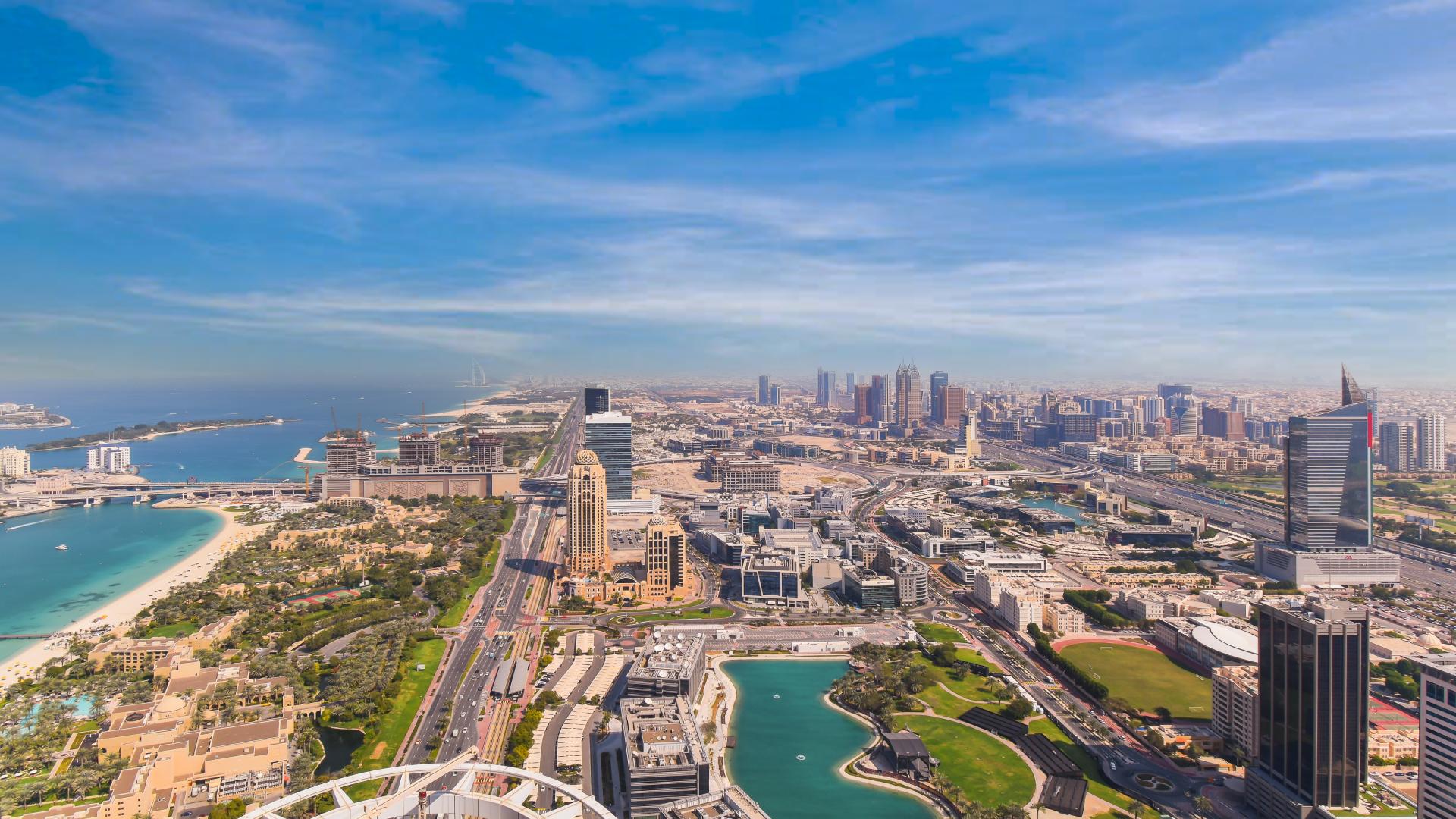 Luxurious living room in renovated penthouse, Dubai Marina Ocean Heights, modern decor, spacious seating