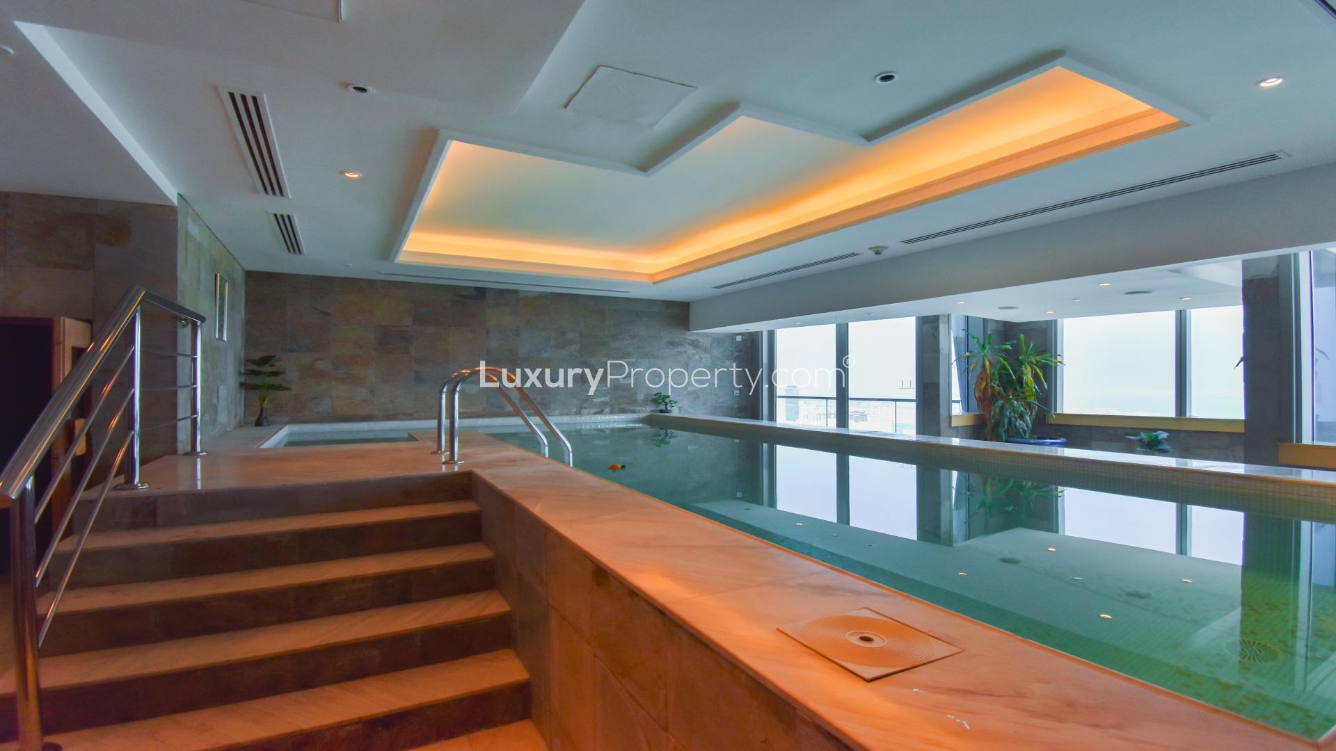 Luxurious living room in renovated Dubai Marina penthouse, Ocean Heights, with plush seating