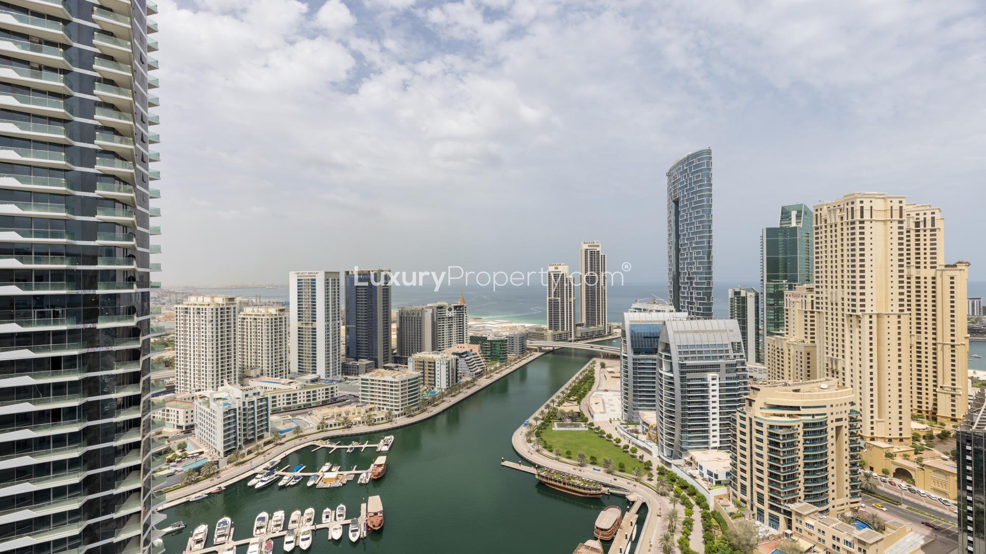 Luxurious living room in Dubai Marina penthouse with modern decor and marina views