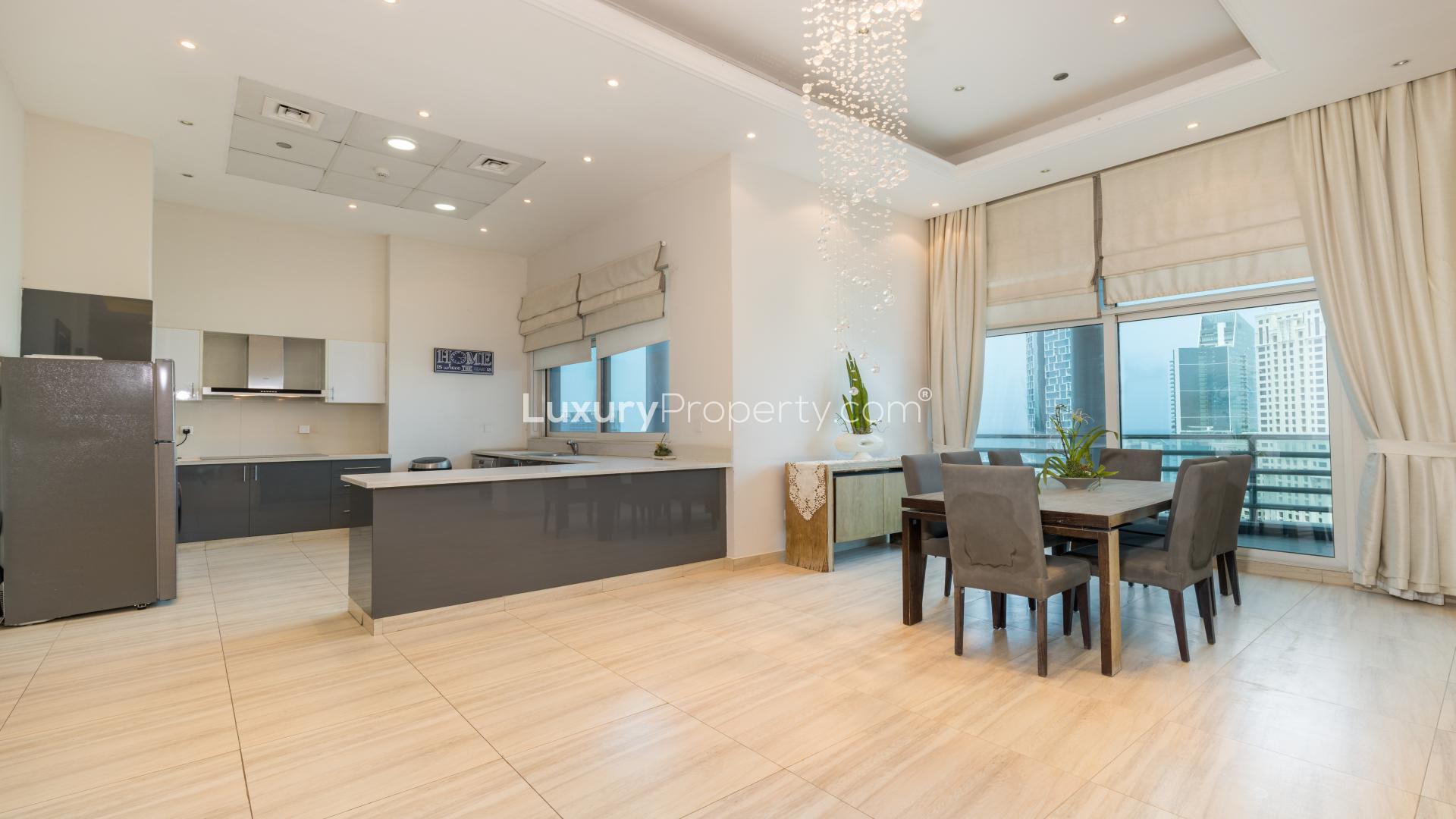 Spacious Dubai Marina penthouse living area with modern decor and marina view