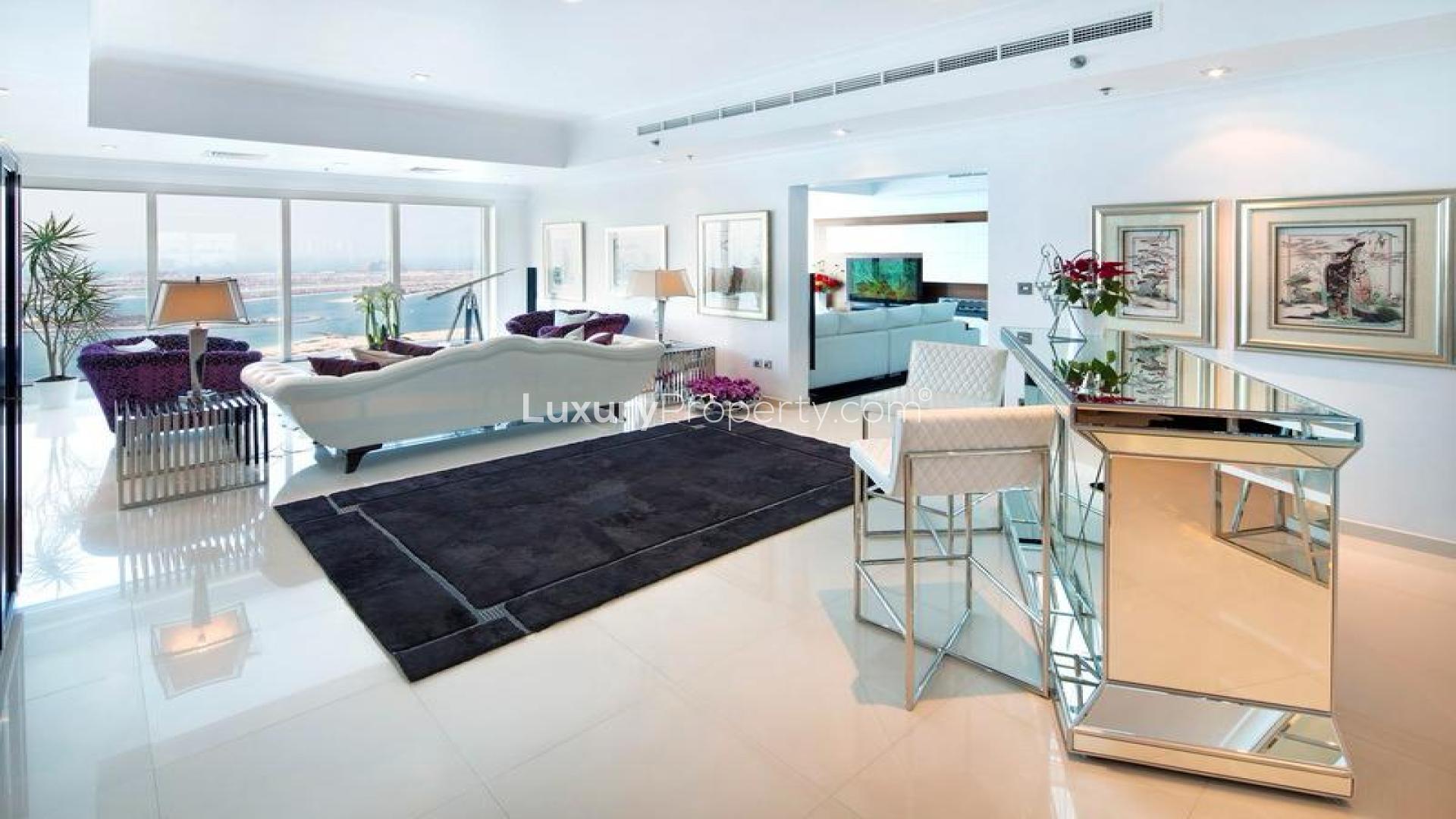 Luxurious Dubai Marina penthouse living room with sea views, elegant decor, and modern furnishings