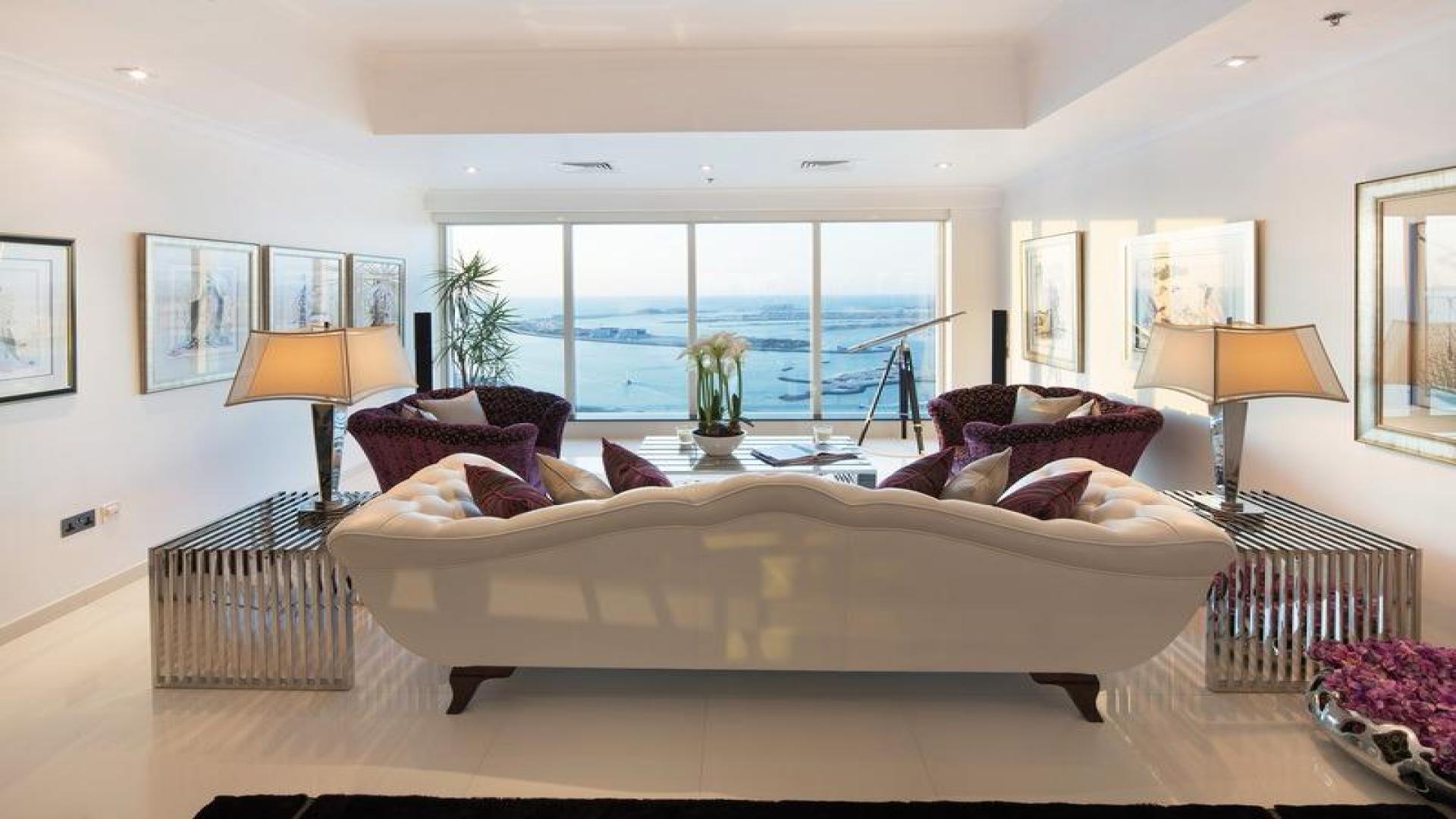 Luxurious Dubai Marina penthouse living room with sea views and elegant interior design