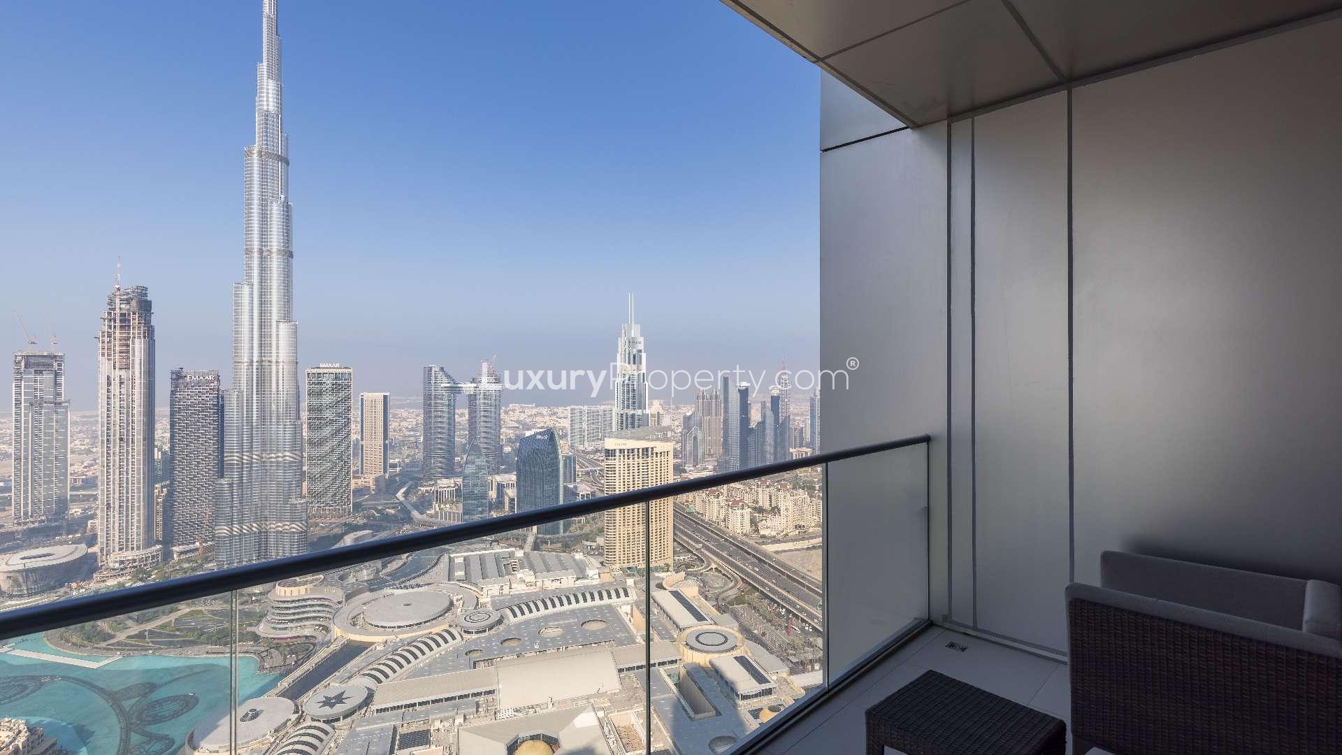 "Penthouse balcony view of Downtown Dubai skyline, Burj Khalifa, Address Residence Fountain Views.",Luxurious dining area in furnished Downtown Dubai penthouse for rent, The Address Residence