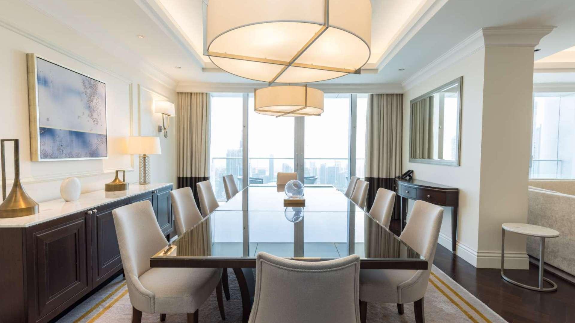 Luxurious dining and living area in 4-bedroom penthouse, The Address BLVD, Downtown Dubai