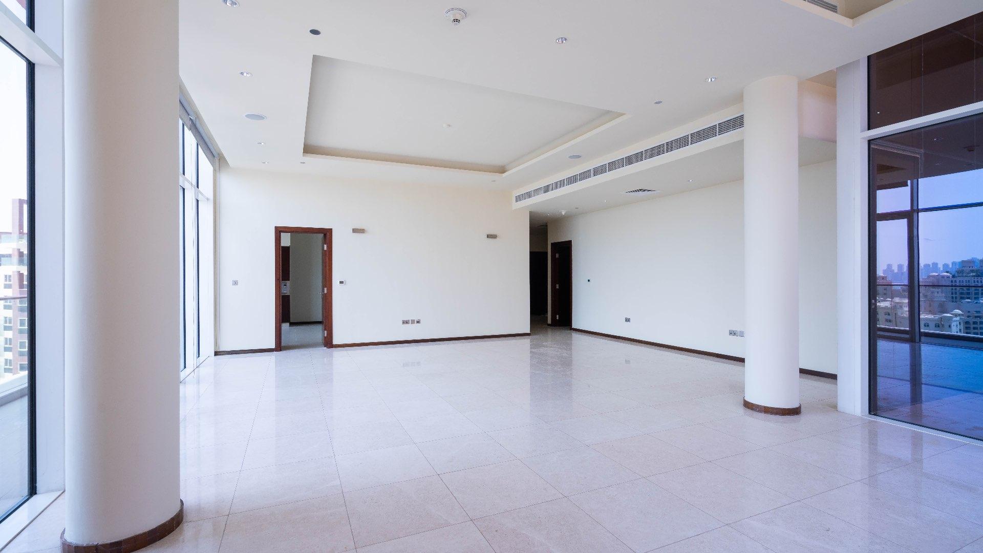 Spacious living area in Tiara Penthouse, Palm Jumeirah with city skyline views