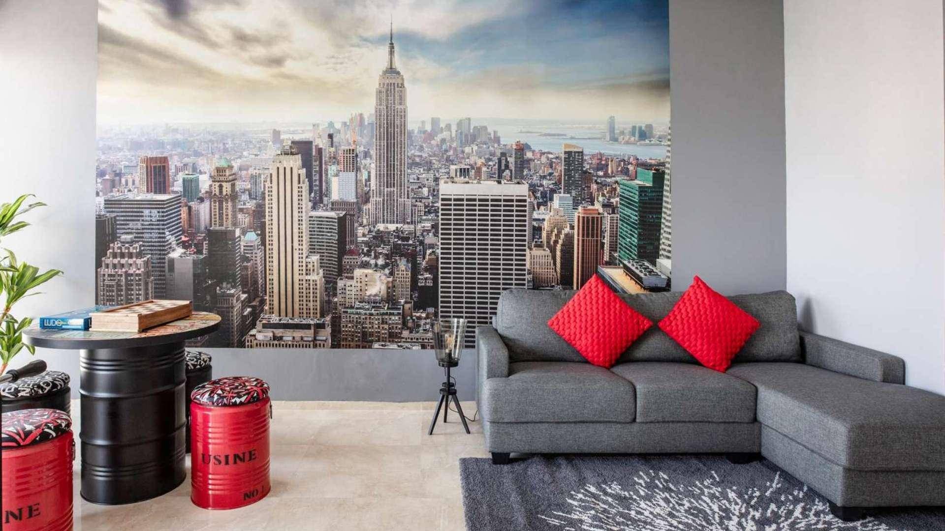 Modern kitchen in Dubai Marina penthouse, featuring sleek cabinets and city views