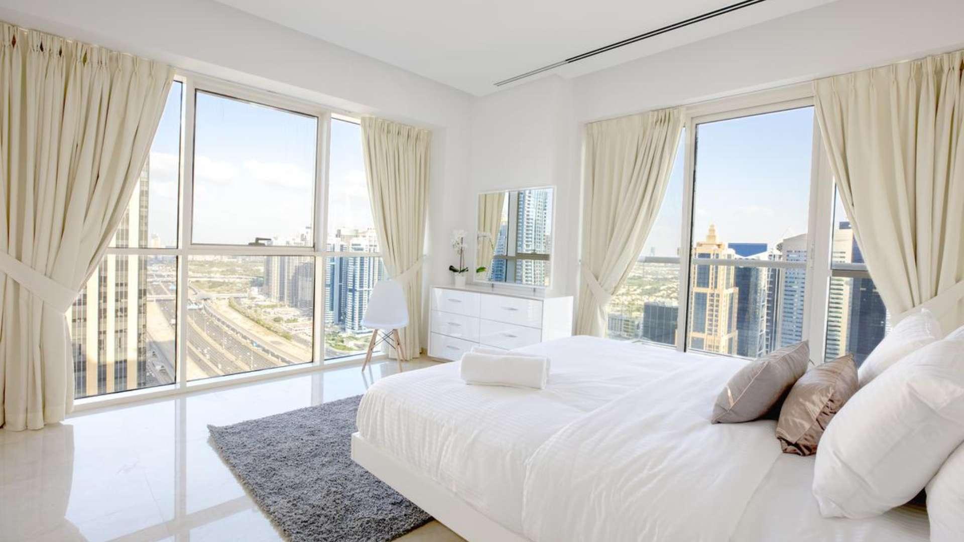 Luxurious living room in 4-bedroom penthouse, West Avenue, Dubai Marina, modern decor, skyline view
