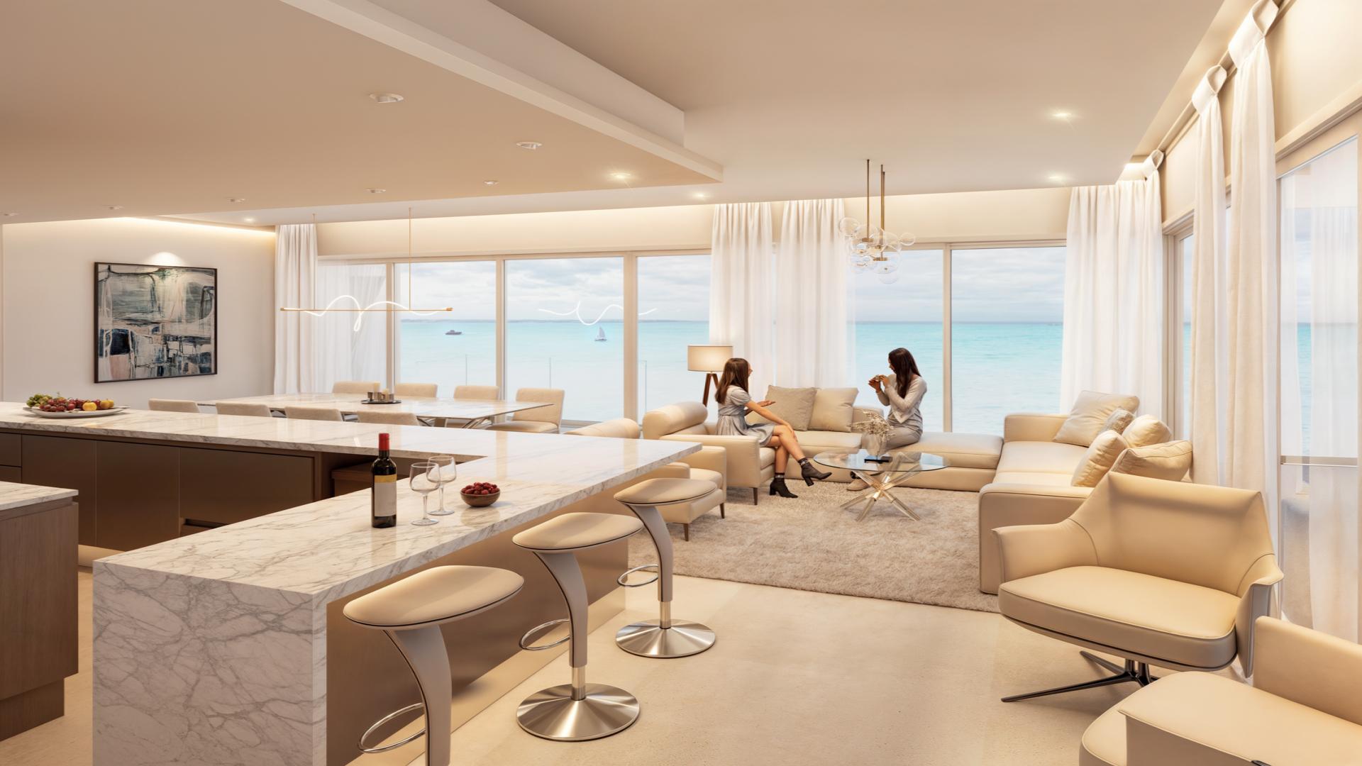 Luxury interior of Cozumel penthouse at The Stella, featuring modern kitchen and dining area