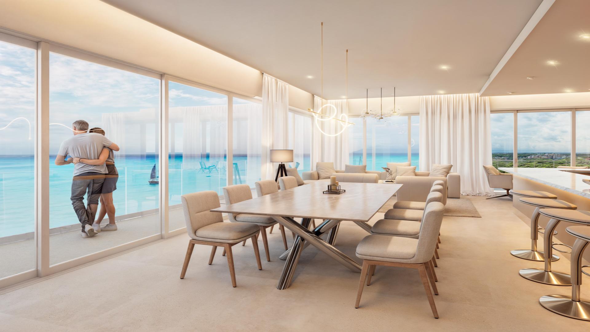 Luxury Cozumel penthouse living area with ocean view, modern decor, and elegant furnishings