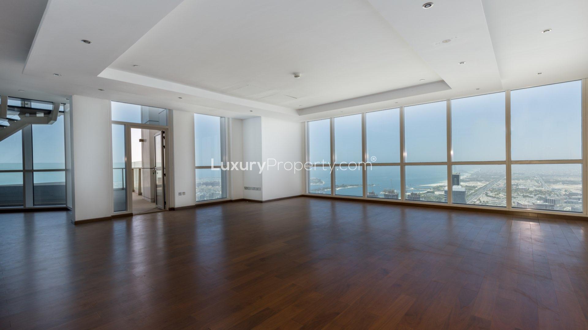 Spacious living area with panoramic sea views in Dubai Marina penthouse for sale