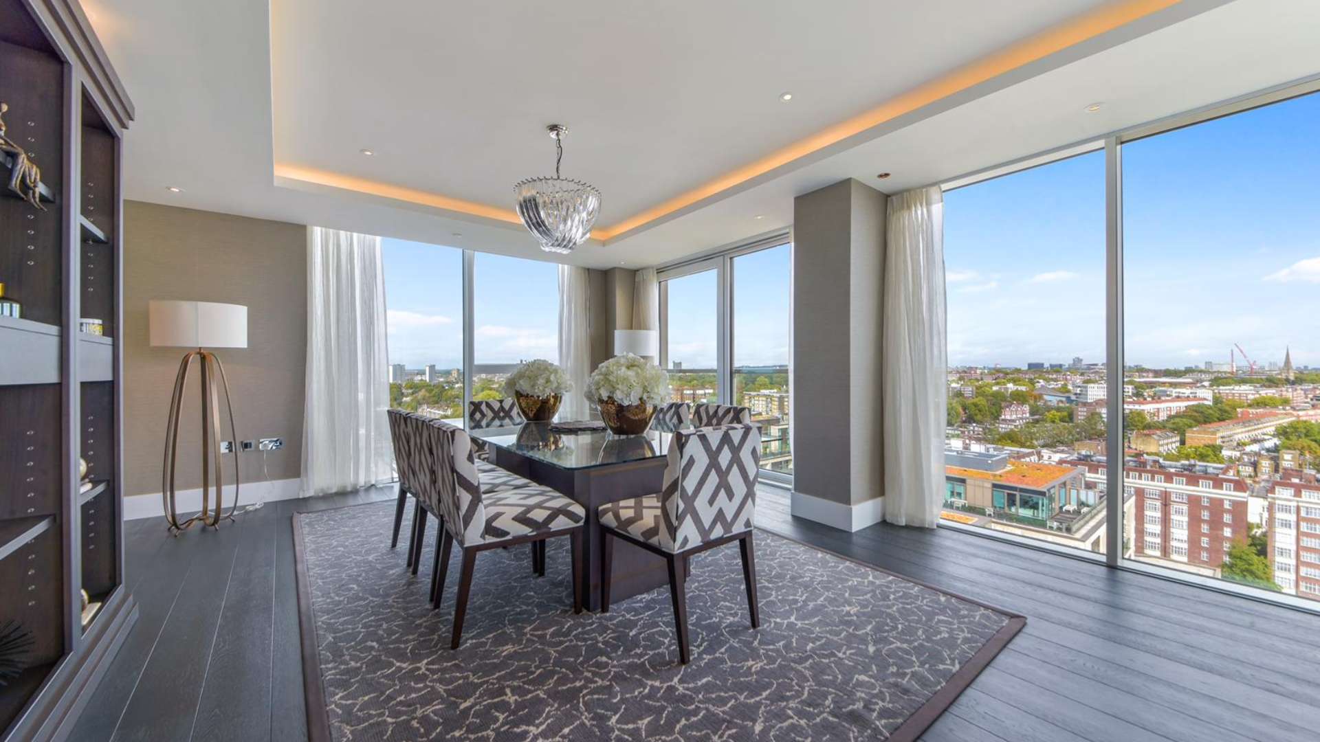 Luxurious living room in three-bedroom penthouse, Edward House, Kensington, with city views