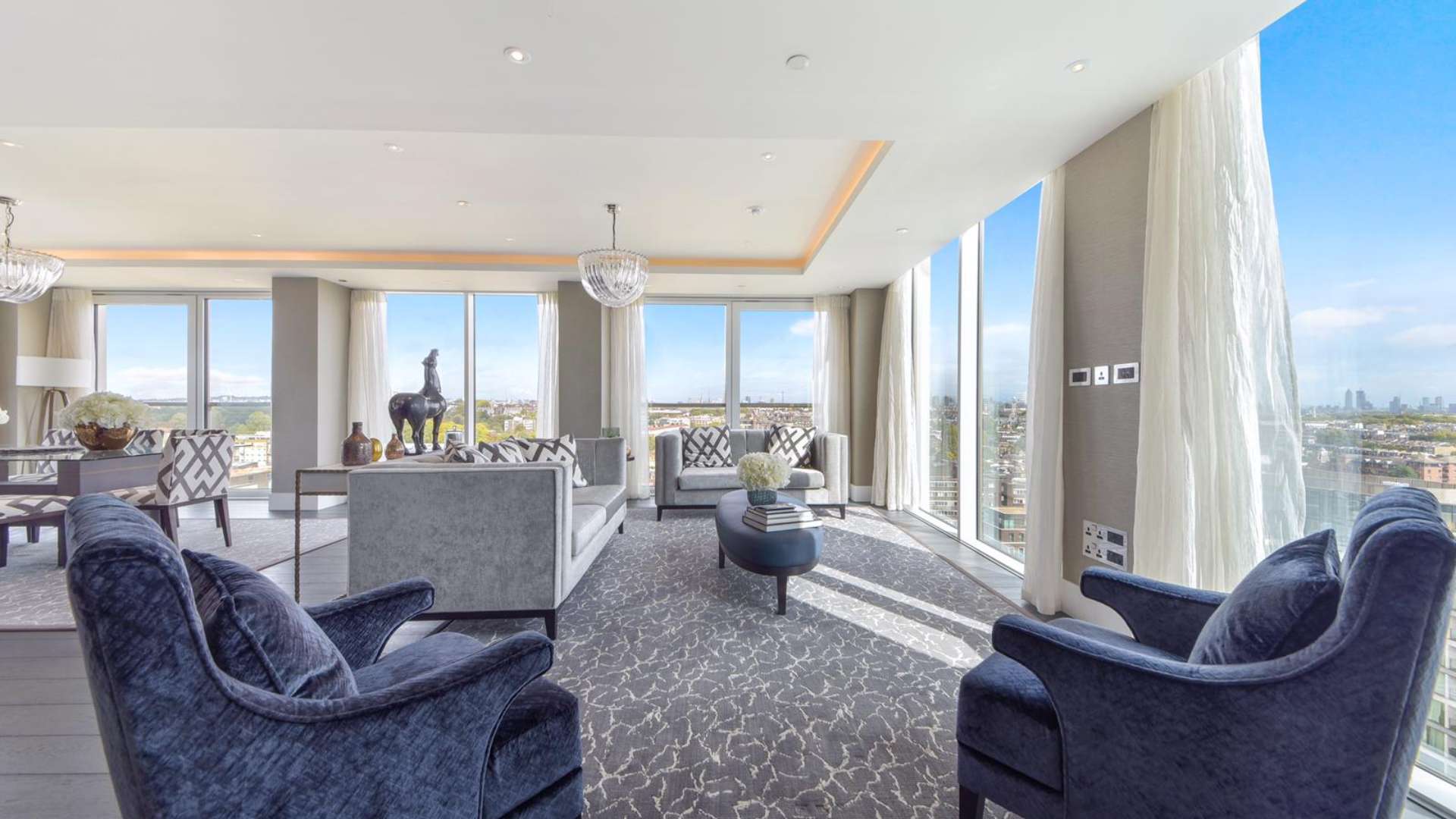 Luxurious bedroom in three-bedroom penthouse, Edward House, Kensington, with city views